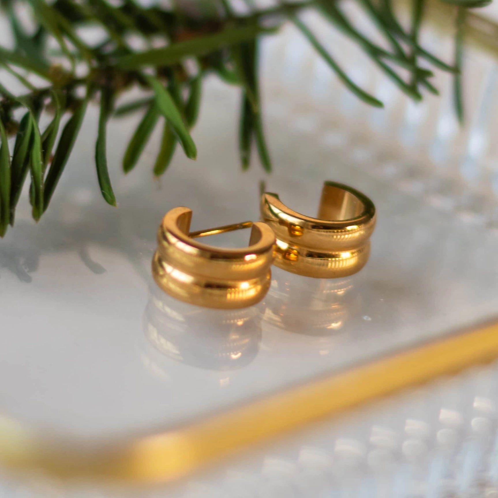 Sela Designs gold or silver dainty huggie hoop earrings ethically made