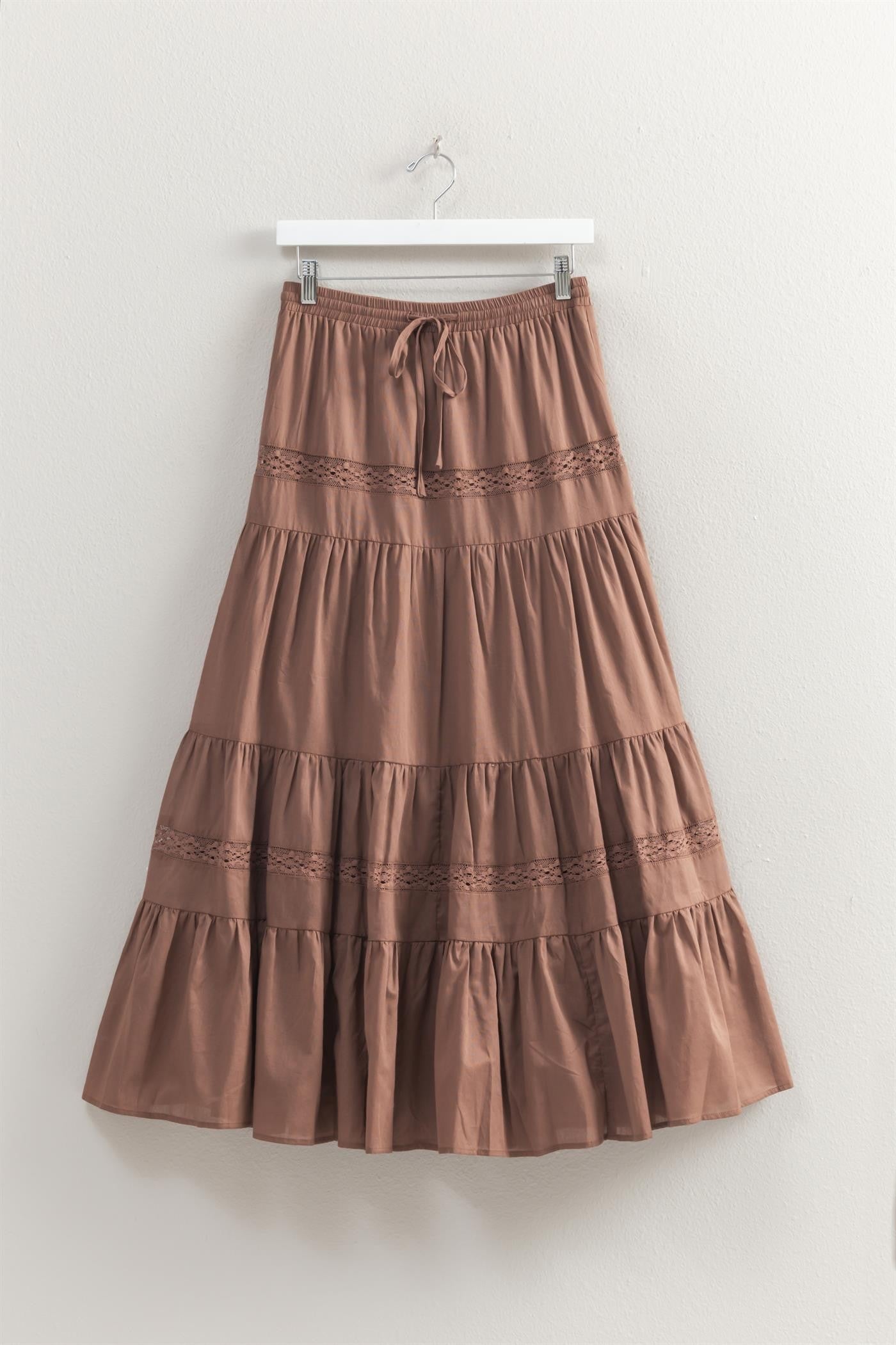 tiered maxi skirt with lace detailing and a elastic waistband with drawstring, has a liner