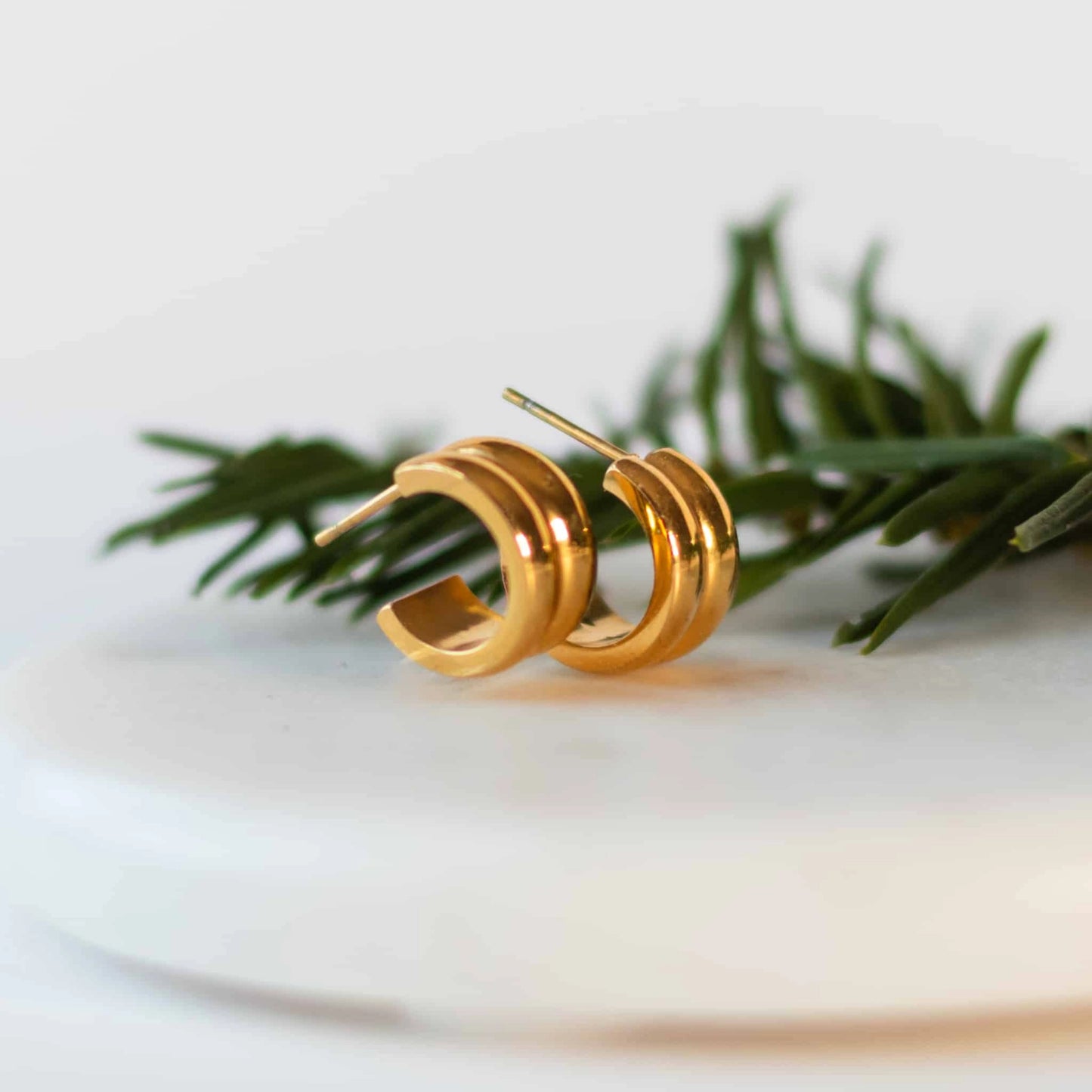 Sela Designs gold or silver dainty huggie hoop earrings ethically made