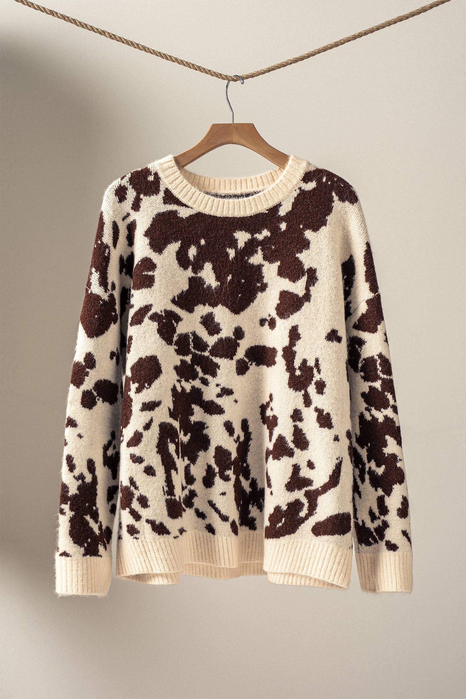 soft oversized cow hide print sweater with crewneck, ribbed neckline hem and cuffs, drop shoulder, very cozy and relaxed not heavy