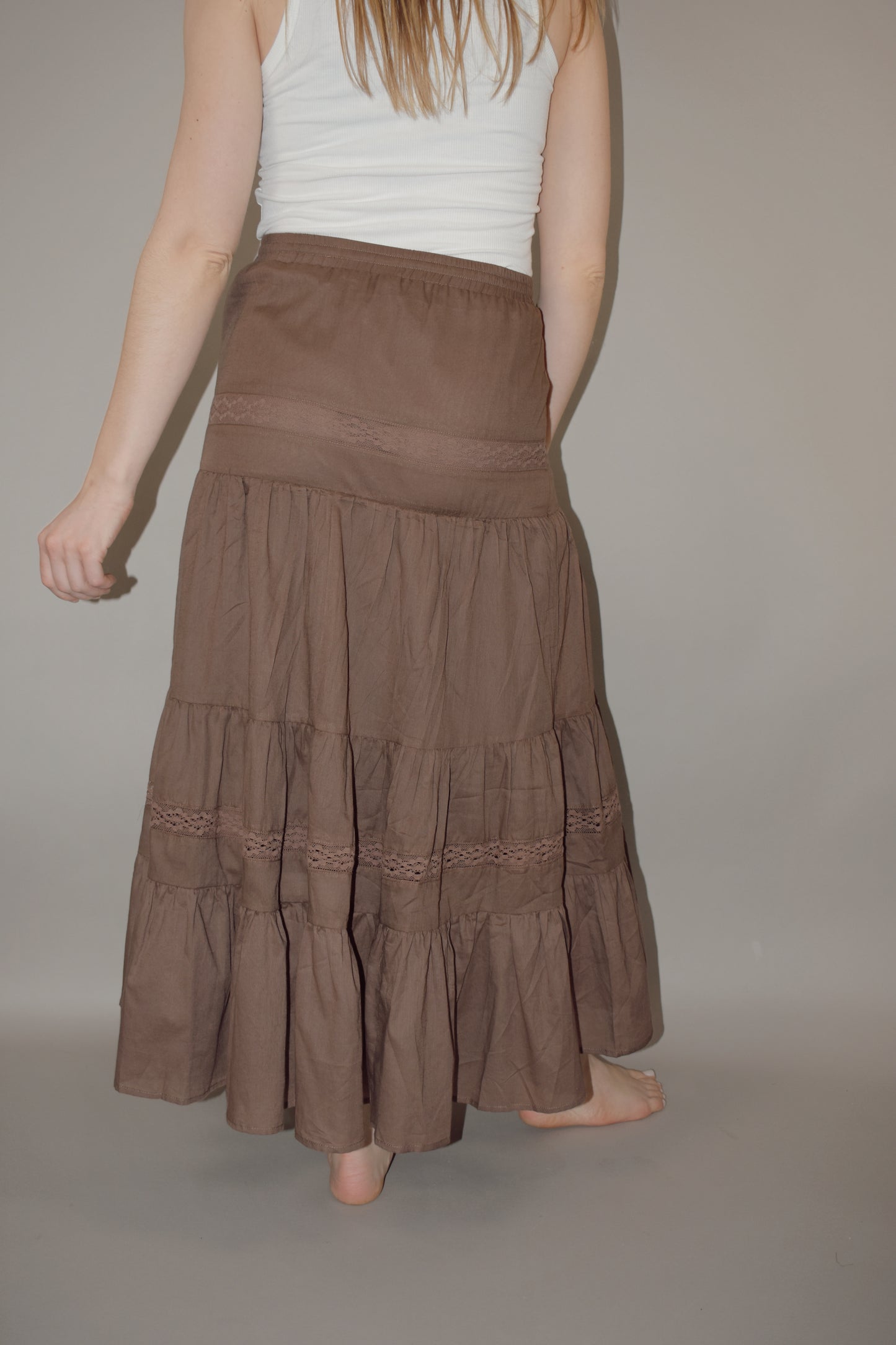 tiered maxi skirt with lace detailing and a elastic waistband with drawstring, has a liner