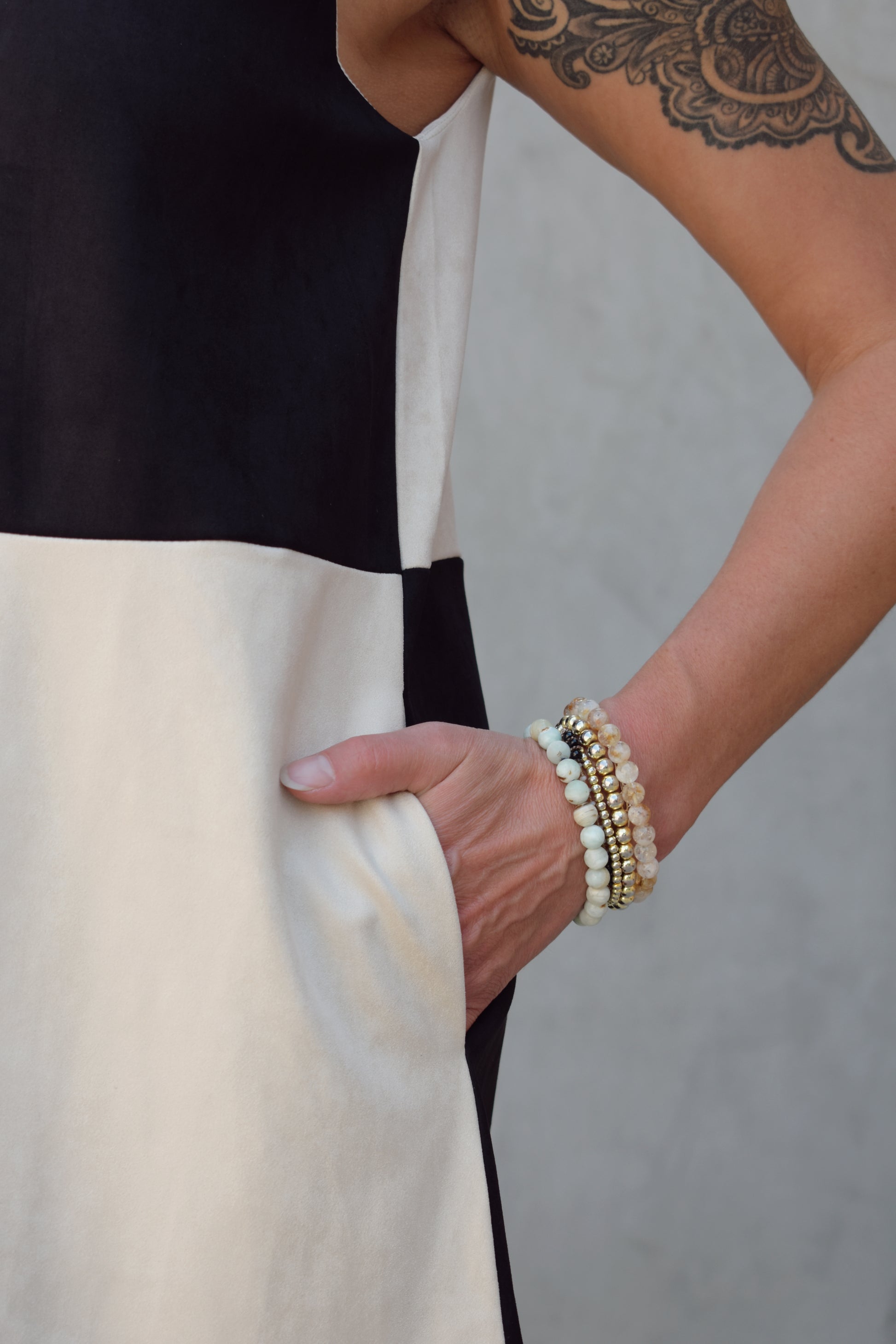 black and ivory color block shift mini dress high neckline sleeveless has pockets
