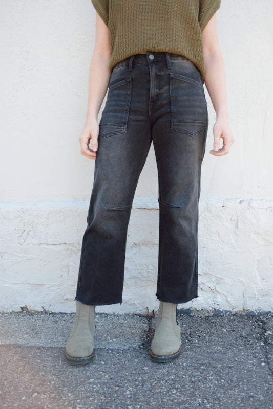 black washed cropped slight barrel jeans stretch denim slanted patch pockets, raw hem, seam detail at knee, high rise, no holes