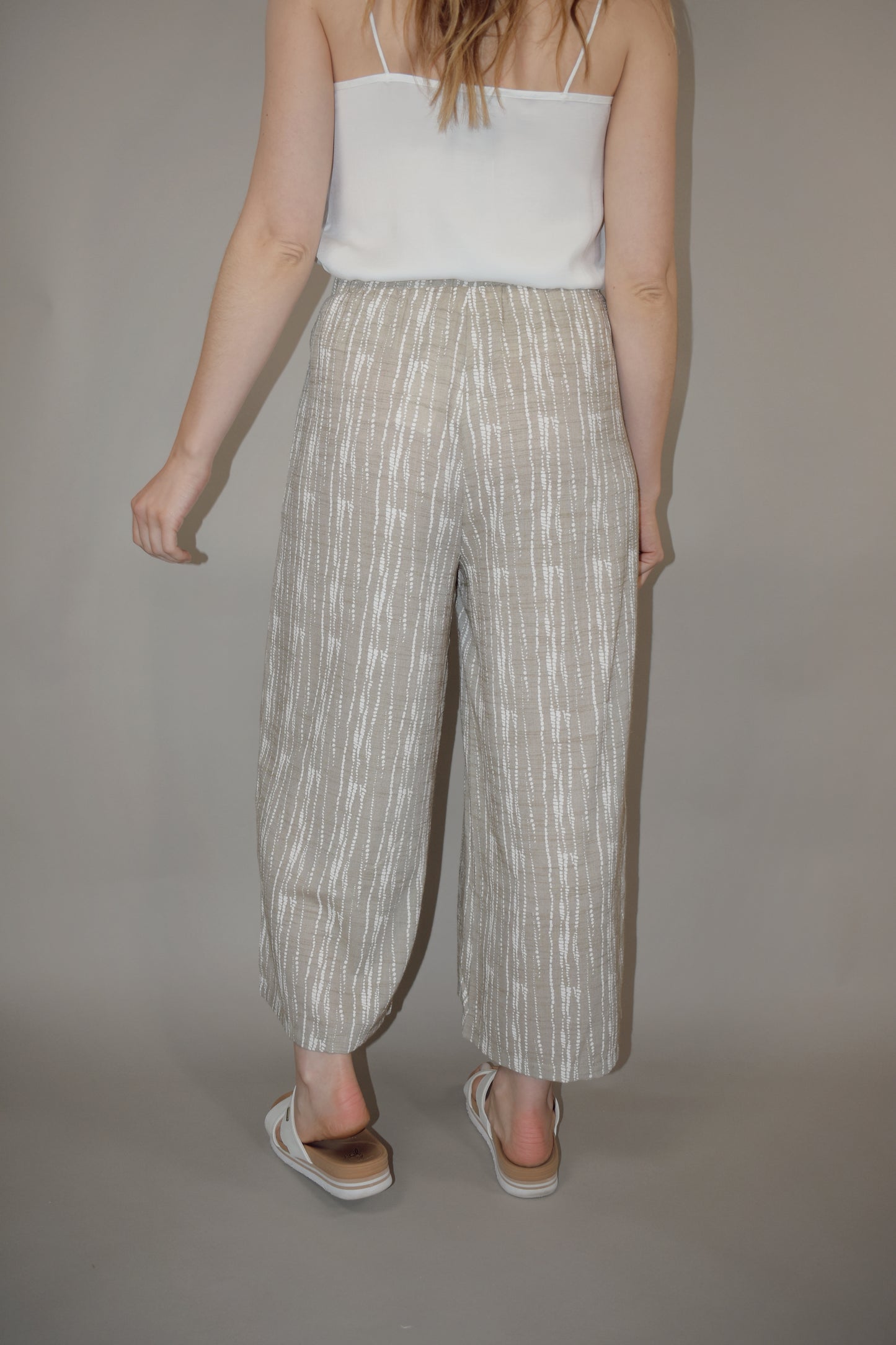 flowy cream and white printed pants slightly cropped, elastic waistband, has pockets, lightweight