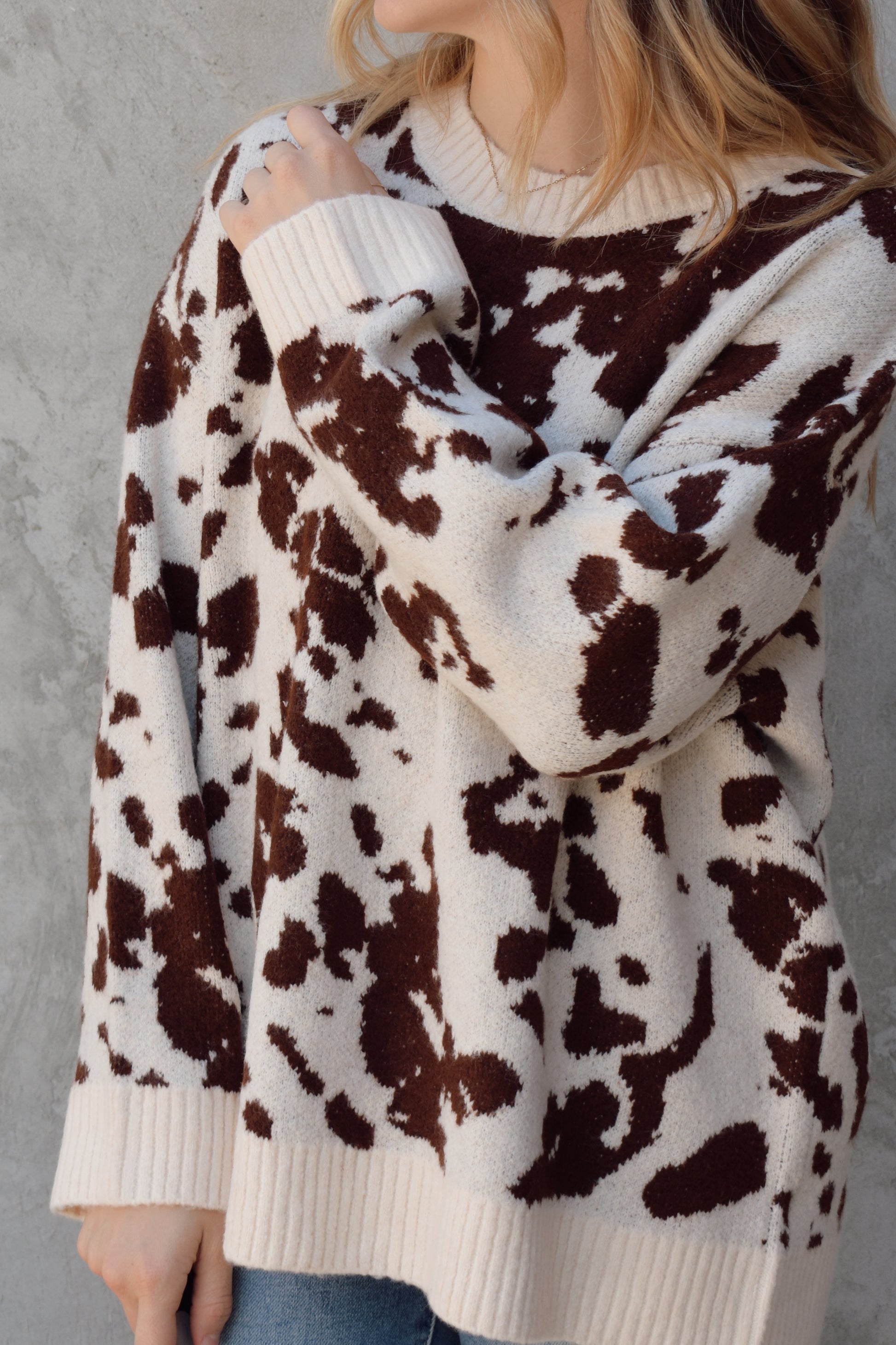 soft oversized cow hide print sweater with crewneck, ribbed neckline hem and cuffs, drop shoulder, very cozy and relaxed not heavy