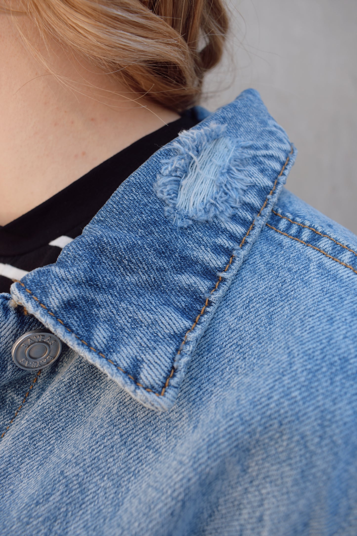 medium wash distressed jean jacket staple for wardrobe relaxed fit full length