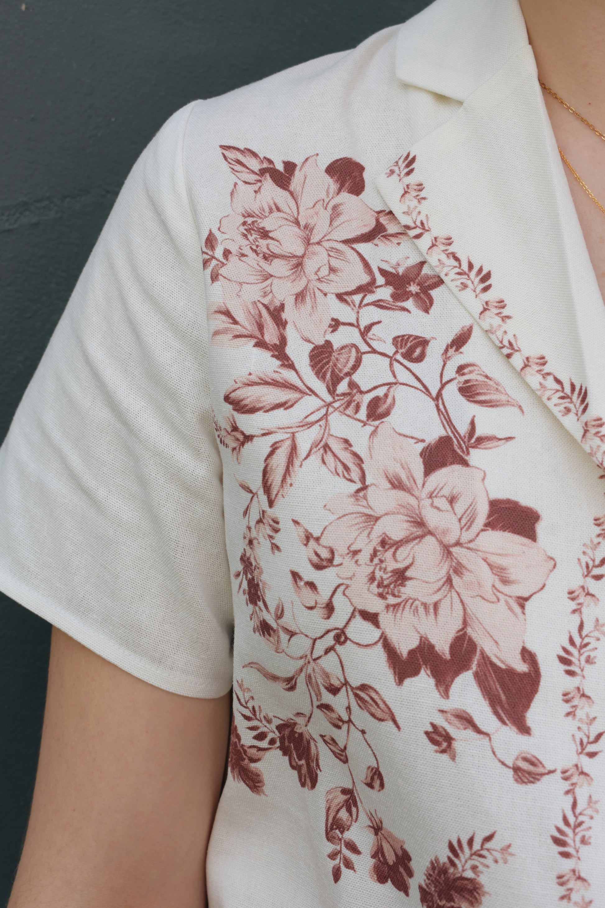 short sleeve off white button down with light maroon printed vintage rose design on front bodice, v neck, relaxed fit