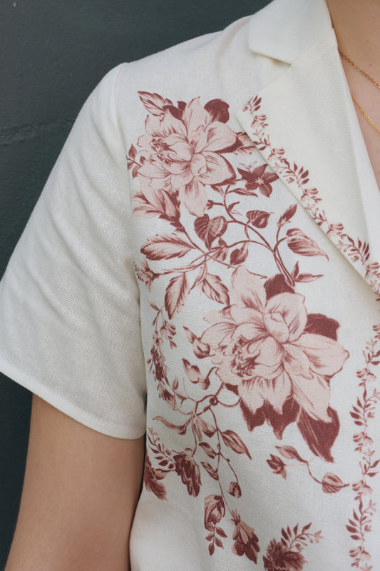 short sleeve off white button down with light maroon printed vintage rose design on front bodice, v neck, relaxed fit