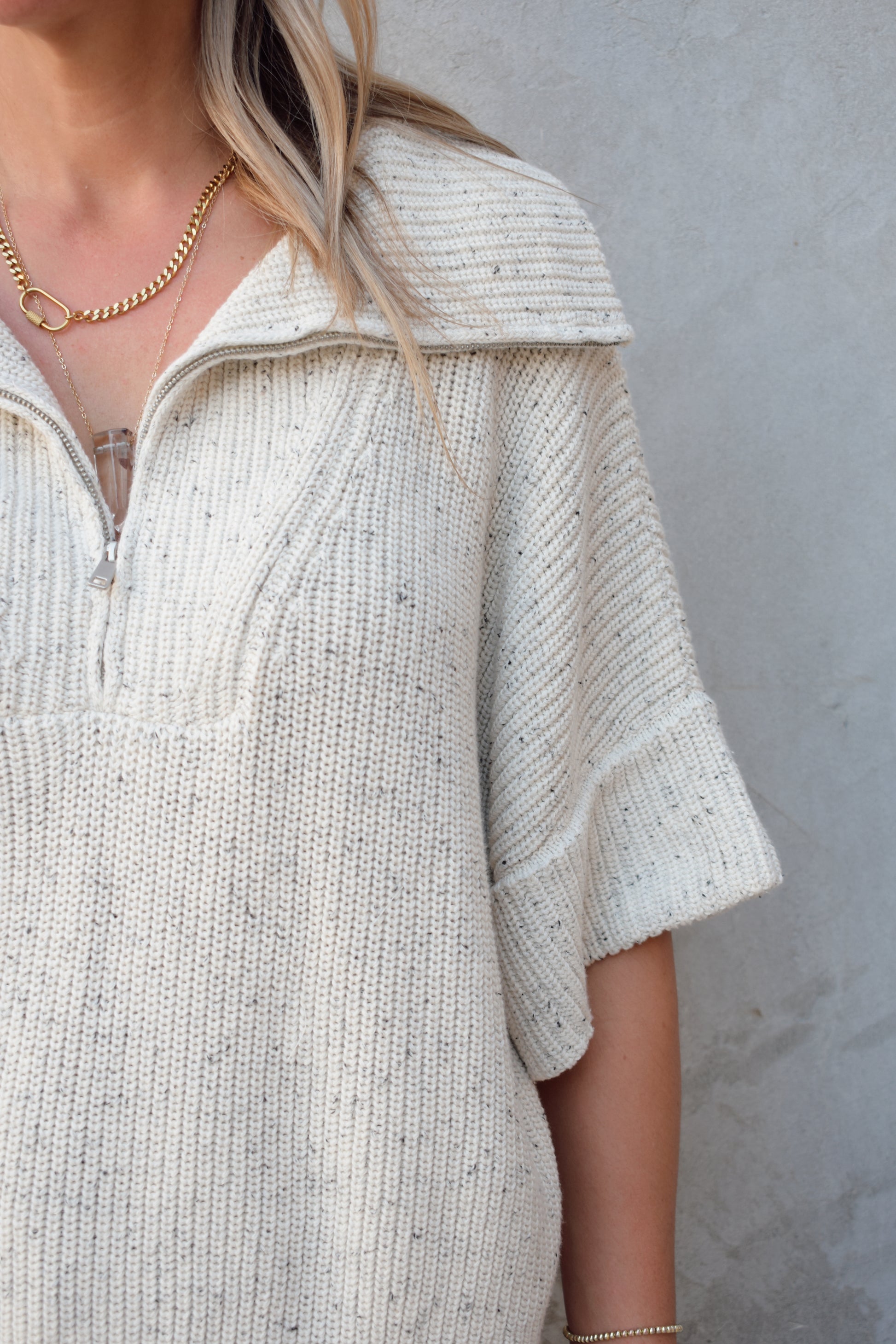 cream half zip short sleeve sweater with oversized collar, relaxed fit, sleeves hit just above elbows