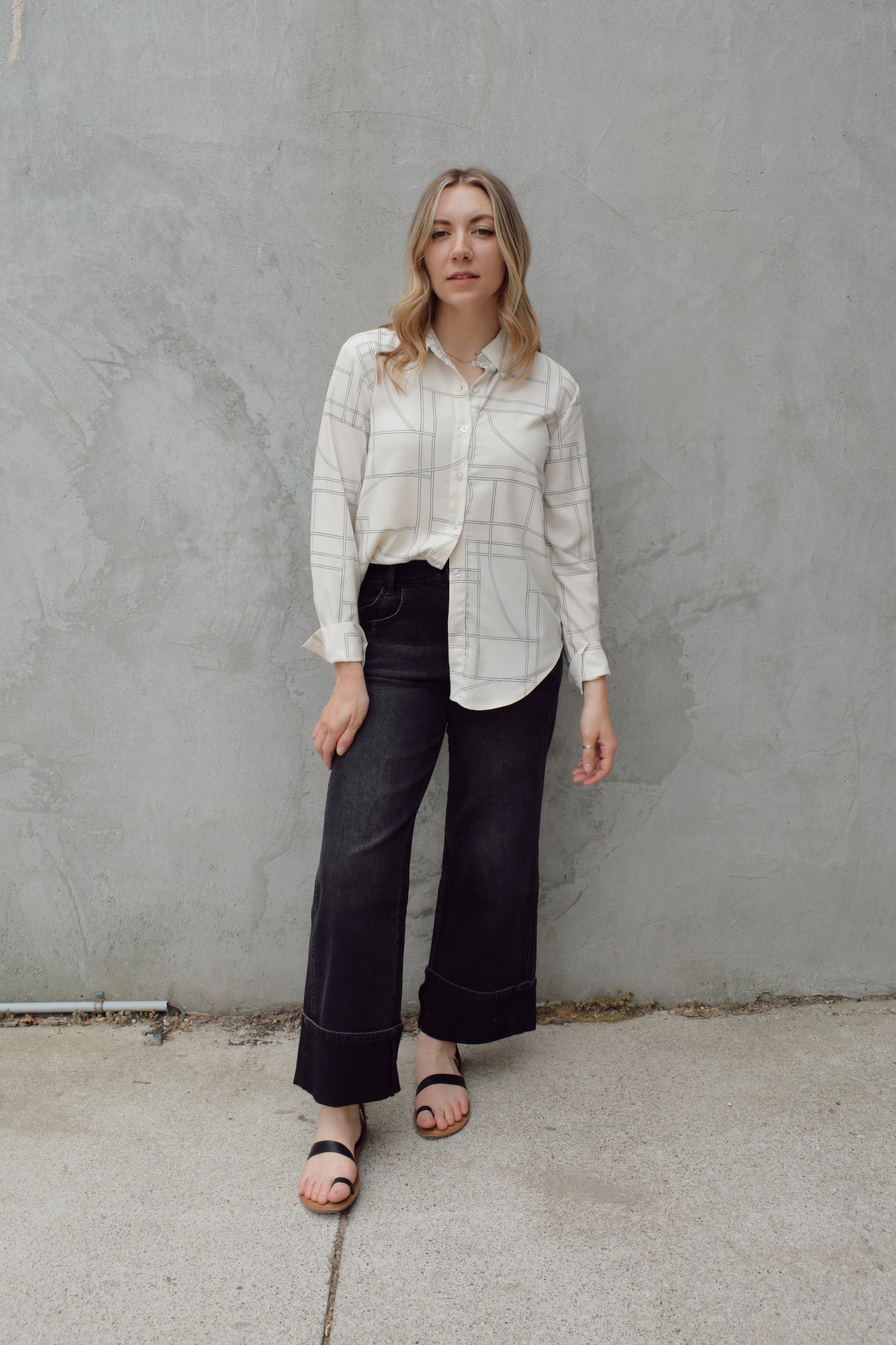 lightweight long sleeve off white button down blouse that has a chic geometric pattern, fitted cuffs, full length straight fit