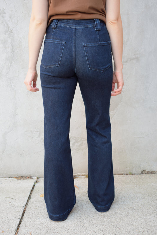 high rise dark wash full length jeans stretch denim patch style oversized front pockets no holes polished look