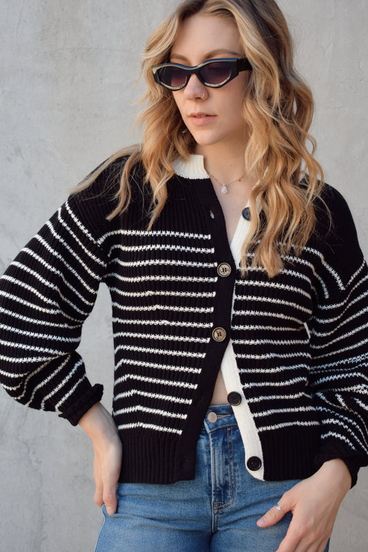 black and white button down cardigan with horizontal stripes drop shoulder balloon sleeves straight fit full length solid white neckline solid black cuffs and hem
