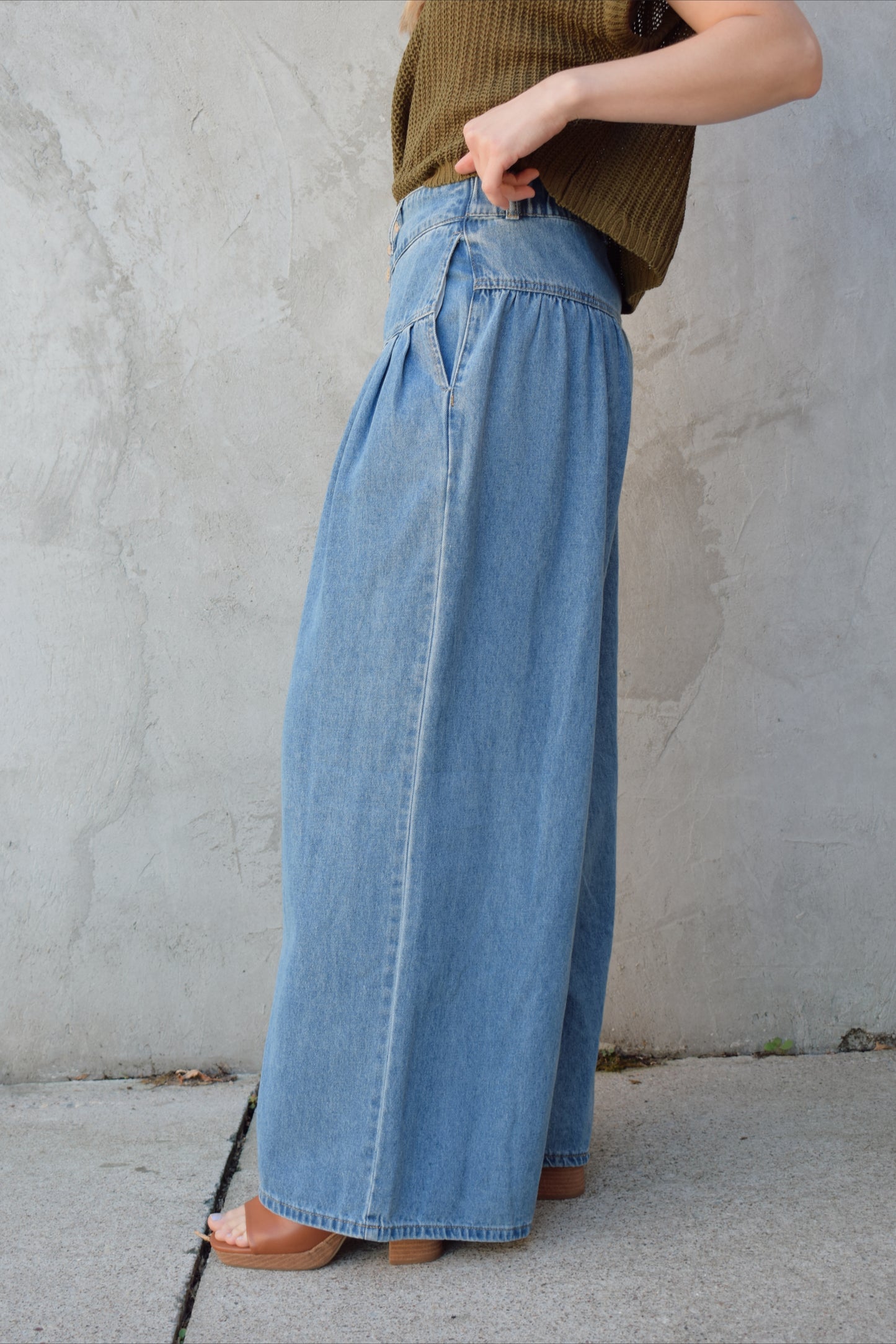 high waisted palazzo jeans light weight has pockets dropped yoke seam and pleats wooden button front enclosure