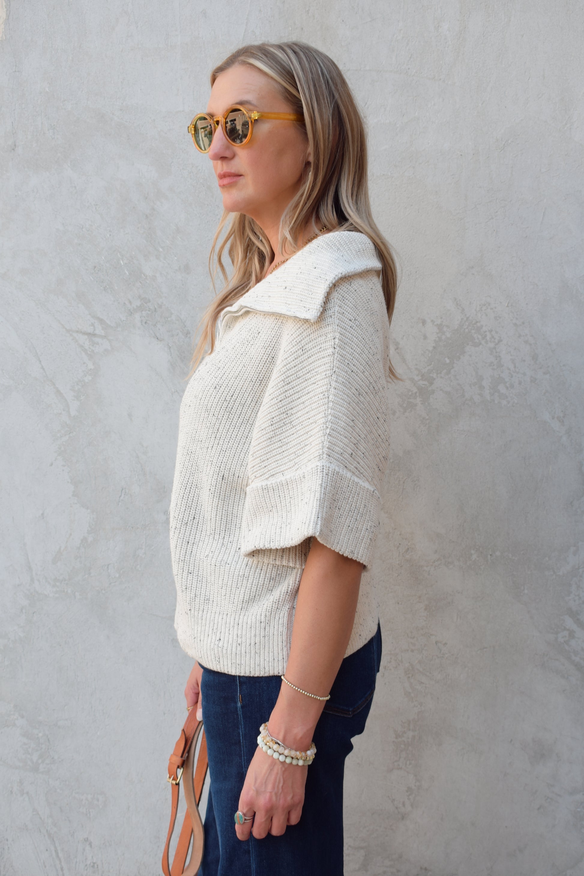 cream half zip short sleeve sweater with oversized collar, relaxed fit, sleeves hit just above elbows