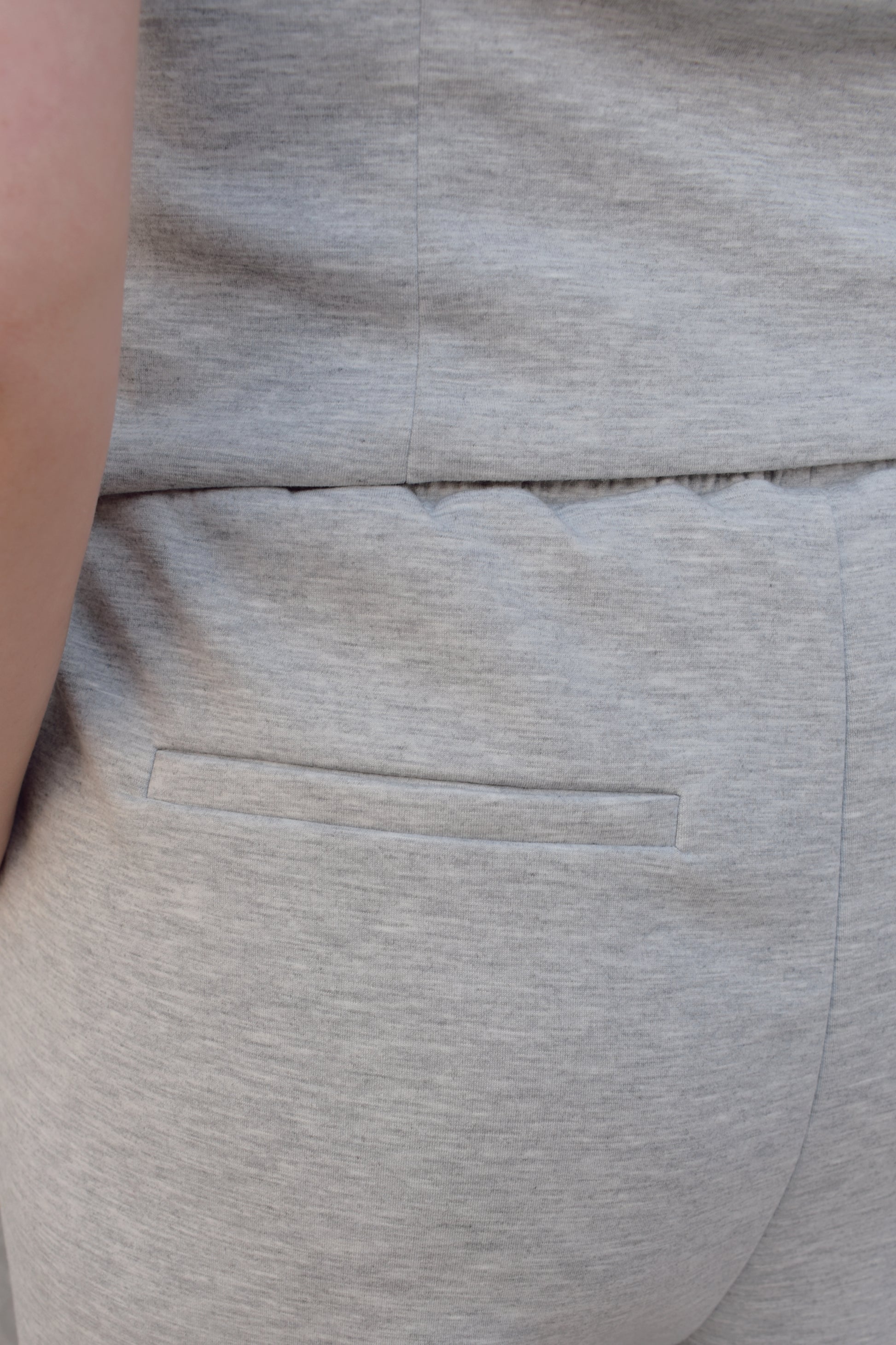 sweatpants style peated trousers with elastic waistband, pockets, fake back pockets, wide leg full length