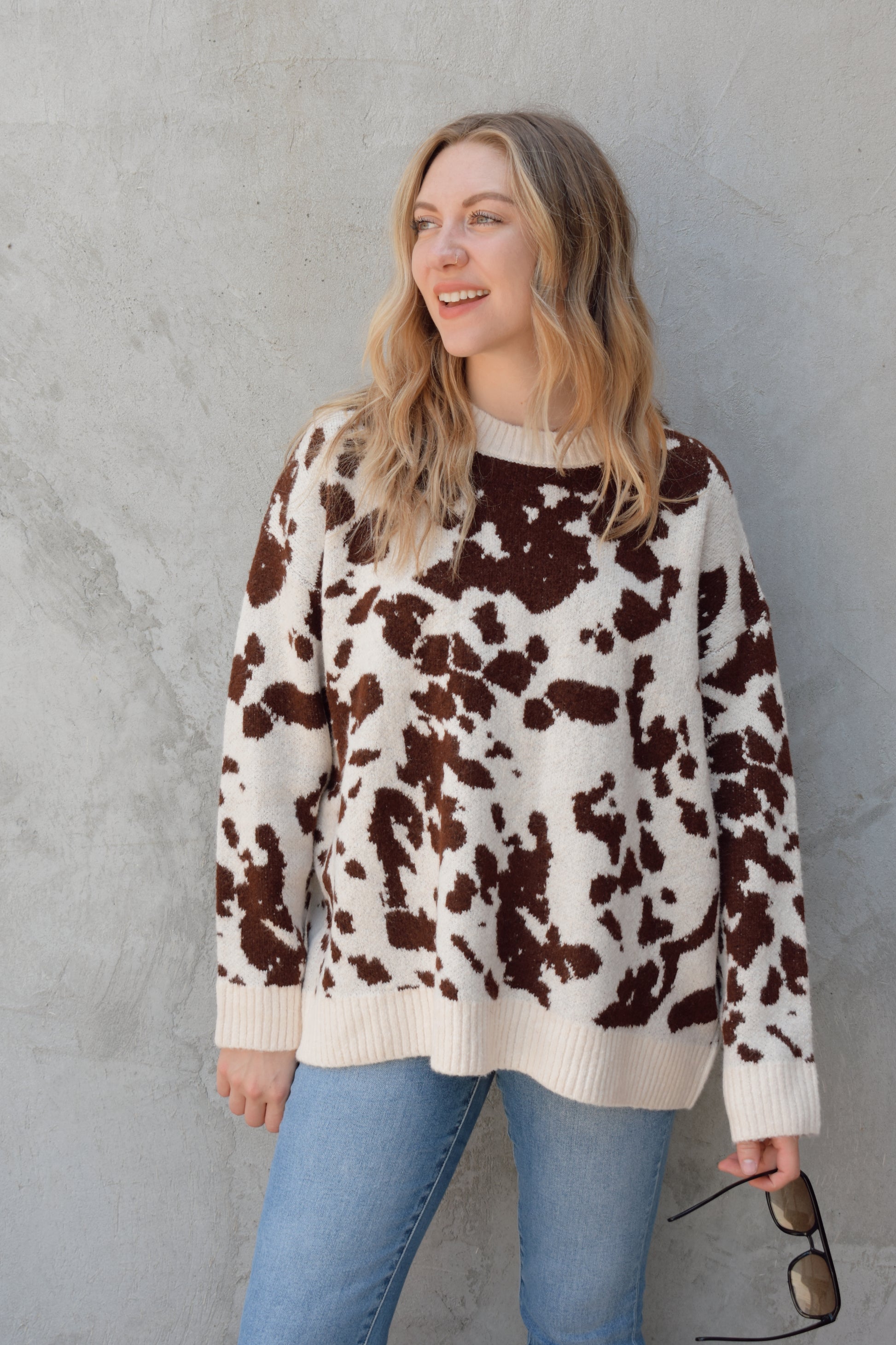 soft oversized cow hide print sweater with crewneck, ribbed neckline hem and cuffs, drop shoulder, very cozy and relaxed not heavy