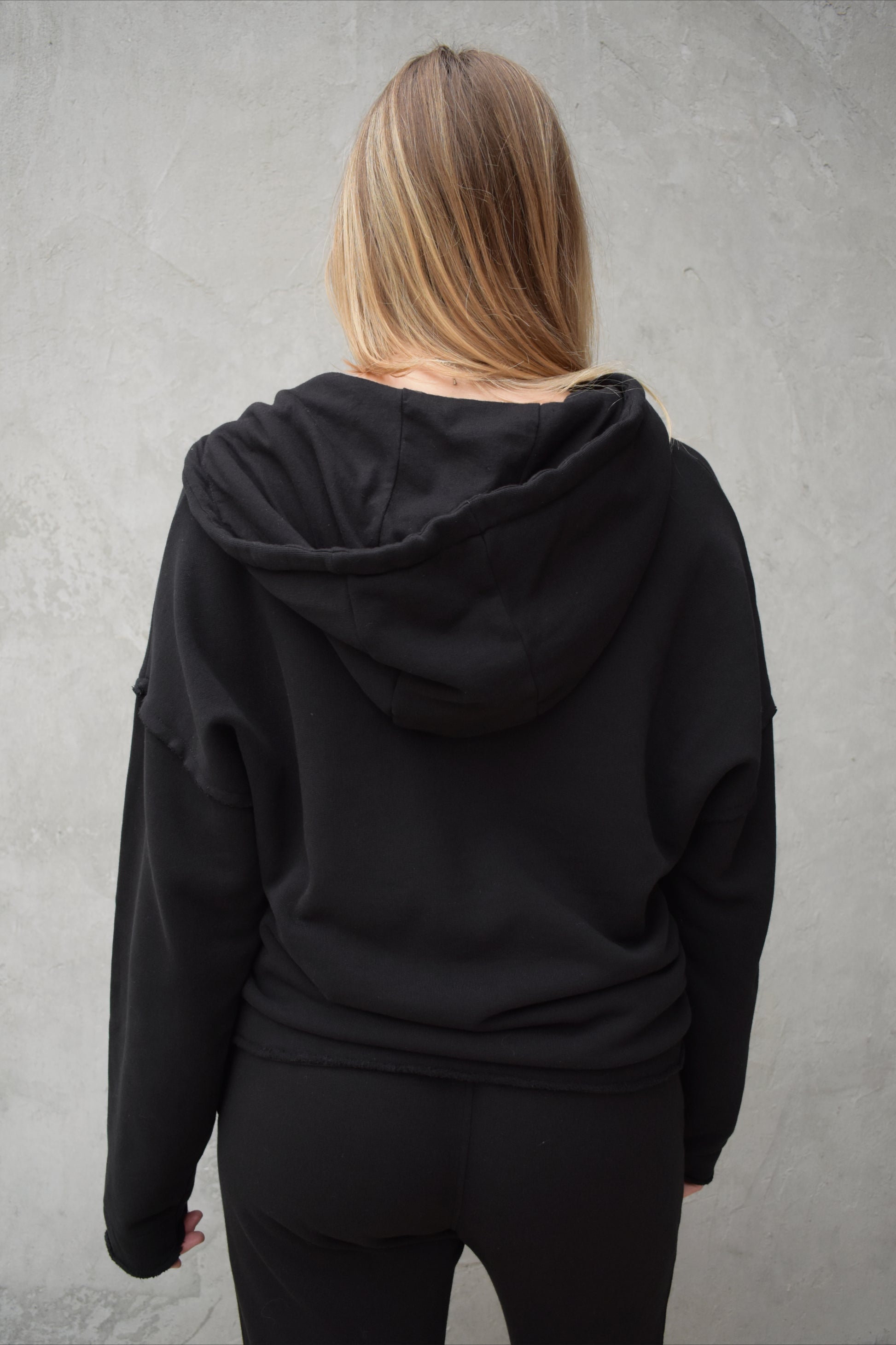 black v neck hoodie - double layered hood with drawstring, drop shoulder, kangaroo pocket, full length relaxed fit, raw edge hems
