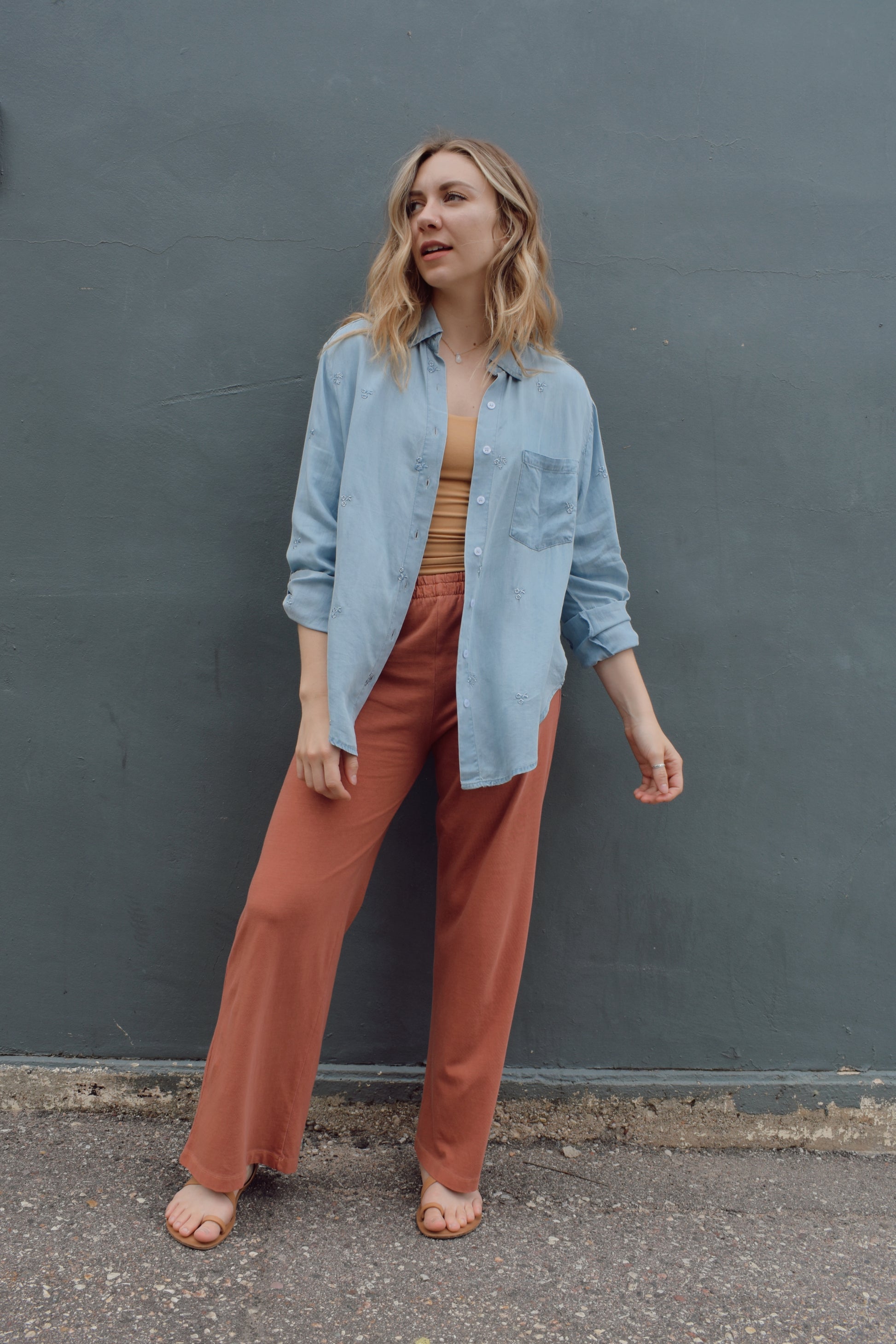 tencel denim chambray button down shirt, oversized relaxed fit, delicate floral embroidery accents same color as button down, one breast patch pocket, sleeves have button for roll up option