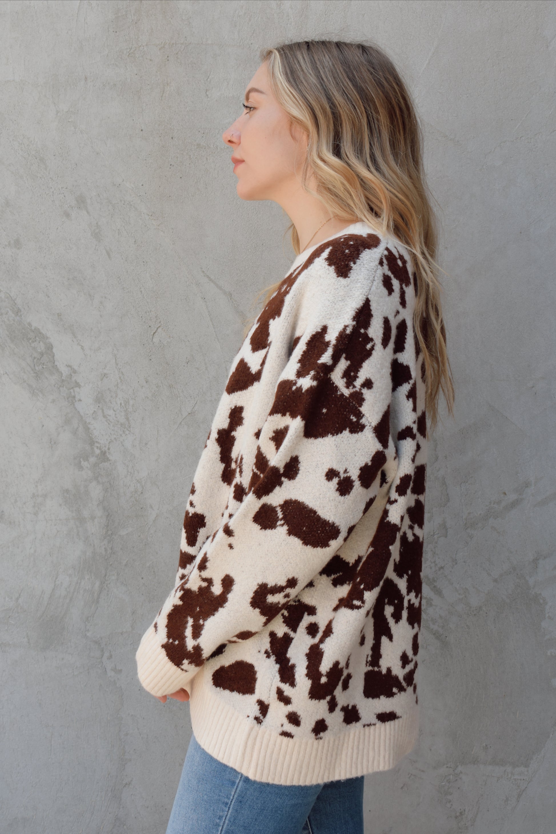 soft oversized cow hide print sweater with crewneck, ribbed neckline hem and cuffs, drop shoulder, very cozy and relaxed not heavy