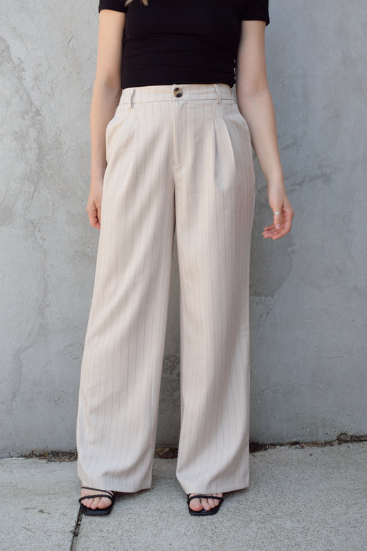 vertical pinstripe trousers with front pleats, pockets, zip and button enclosure, has beltloops, fake back pockets, elastic on back of waistband, full length