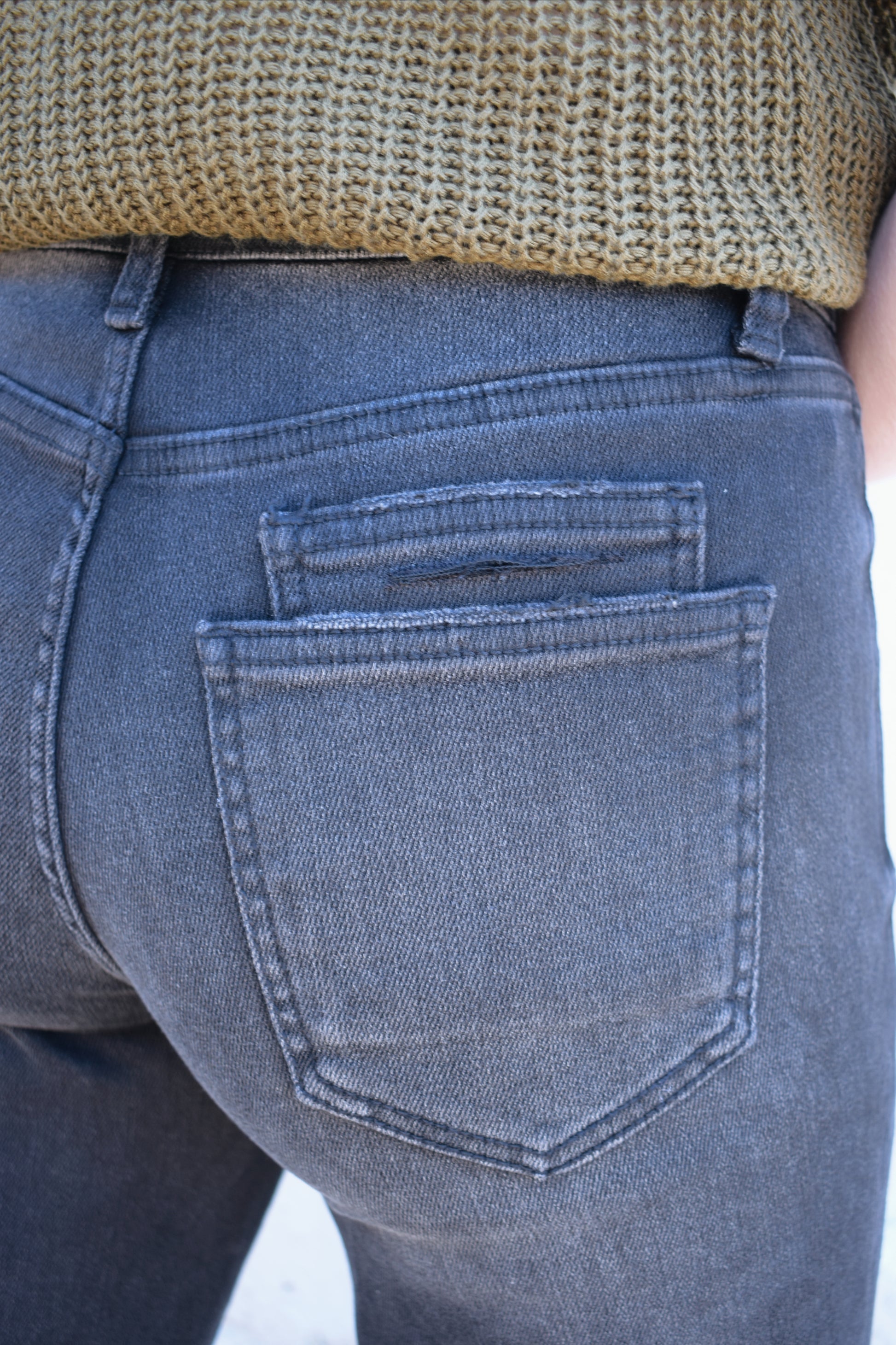 black washed cropped slight barrel jeans stretch denim slanted patch pockets, raw hem, seam detail at knee, high rise, no holes