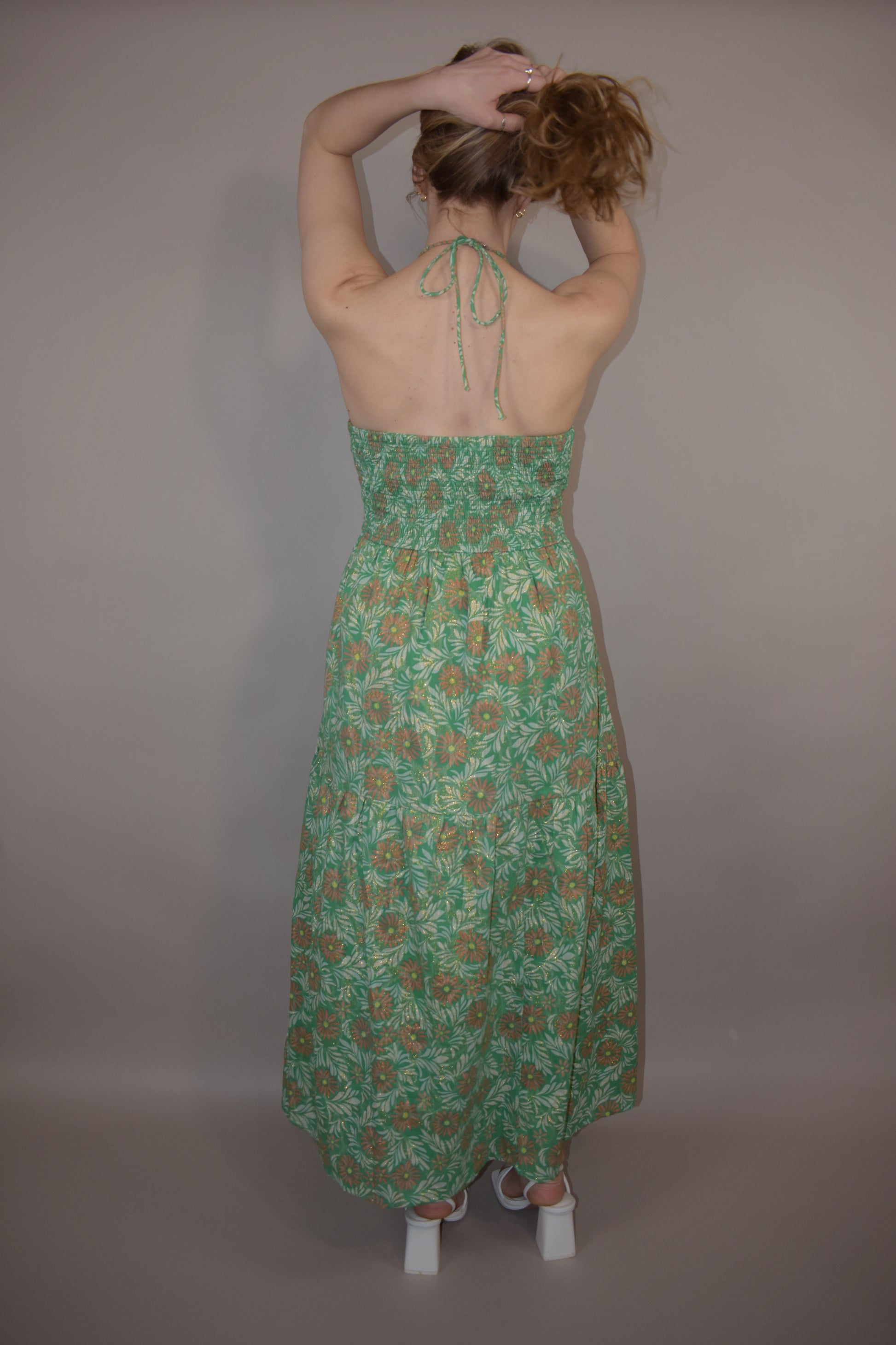 floral halter maxi dress with double v and smocked bodice gold thread tiered skirt event dress