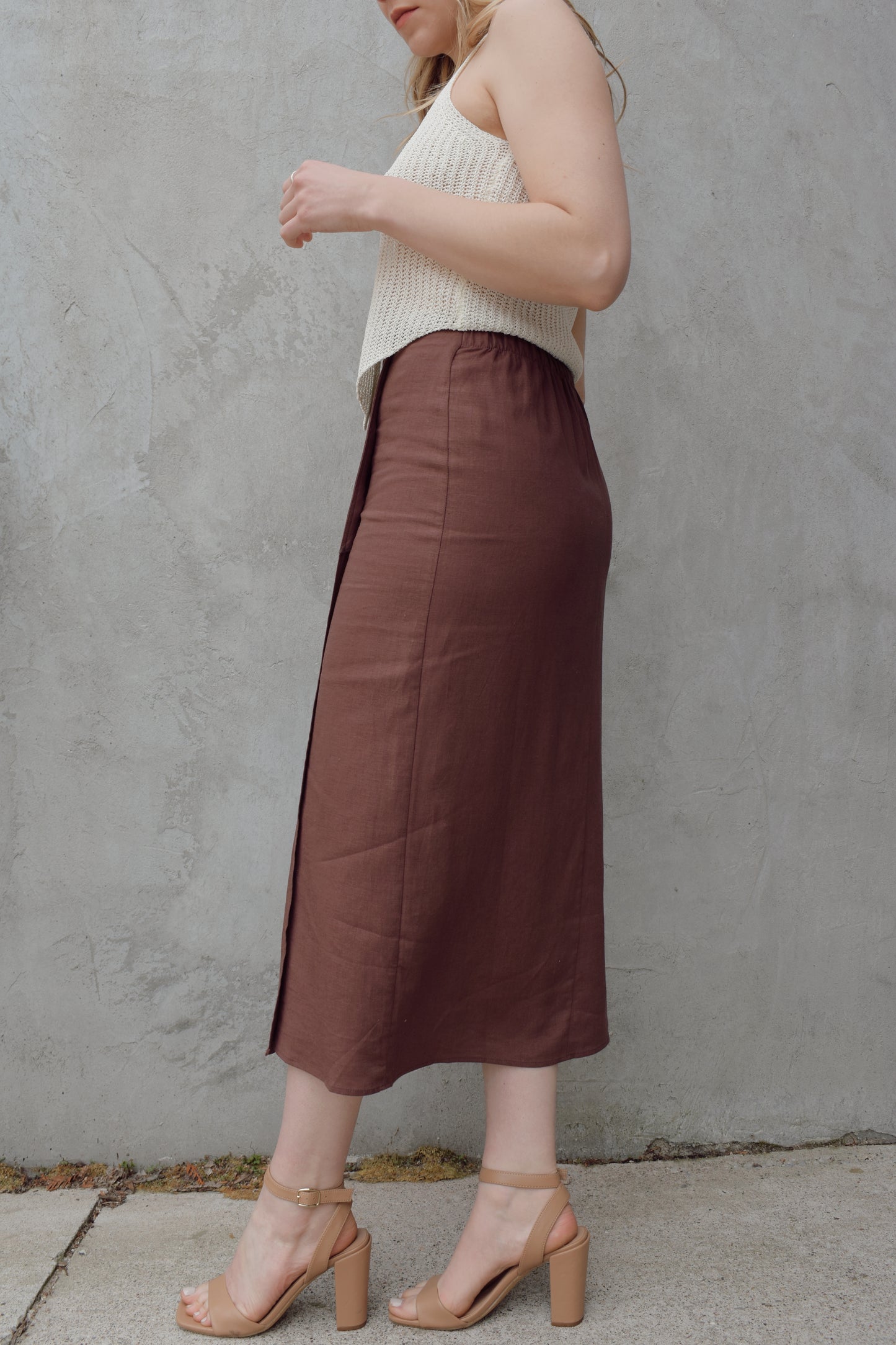 high waisted linen wrap skirt with 3 wooden button enclosure midi length stretch on back of waistband