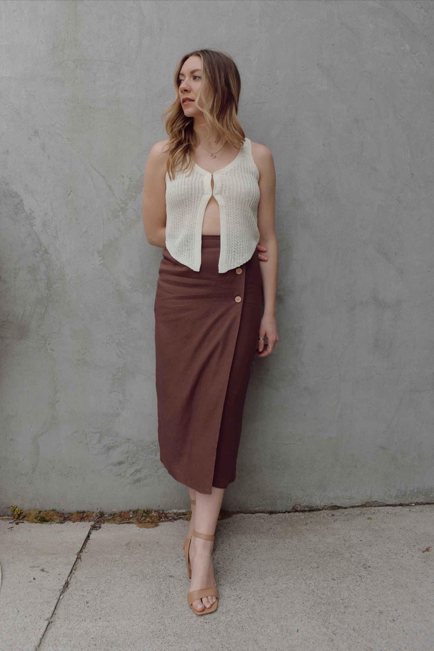 high waisted linen wrap skirt with 3 wooden button enclosure midi length stretch on back of waistband