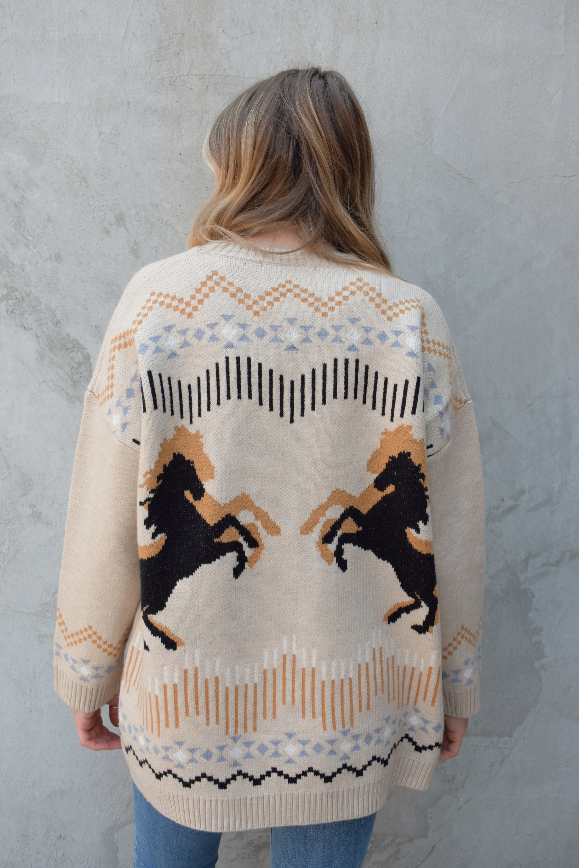 cardigan with western pattern and horses on the back, open front, no pockets, oversized fit, drop shoulder, ribbed hem and cuffs