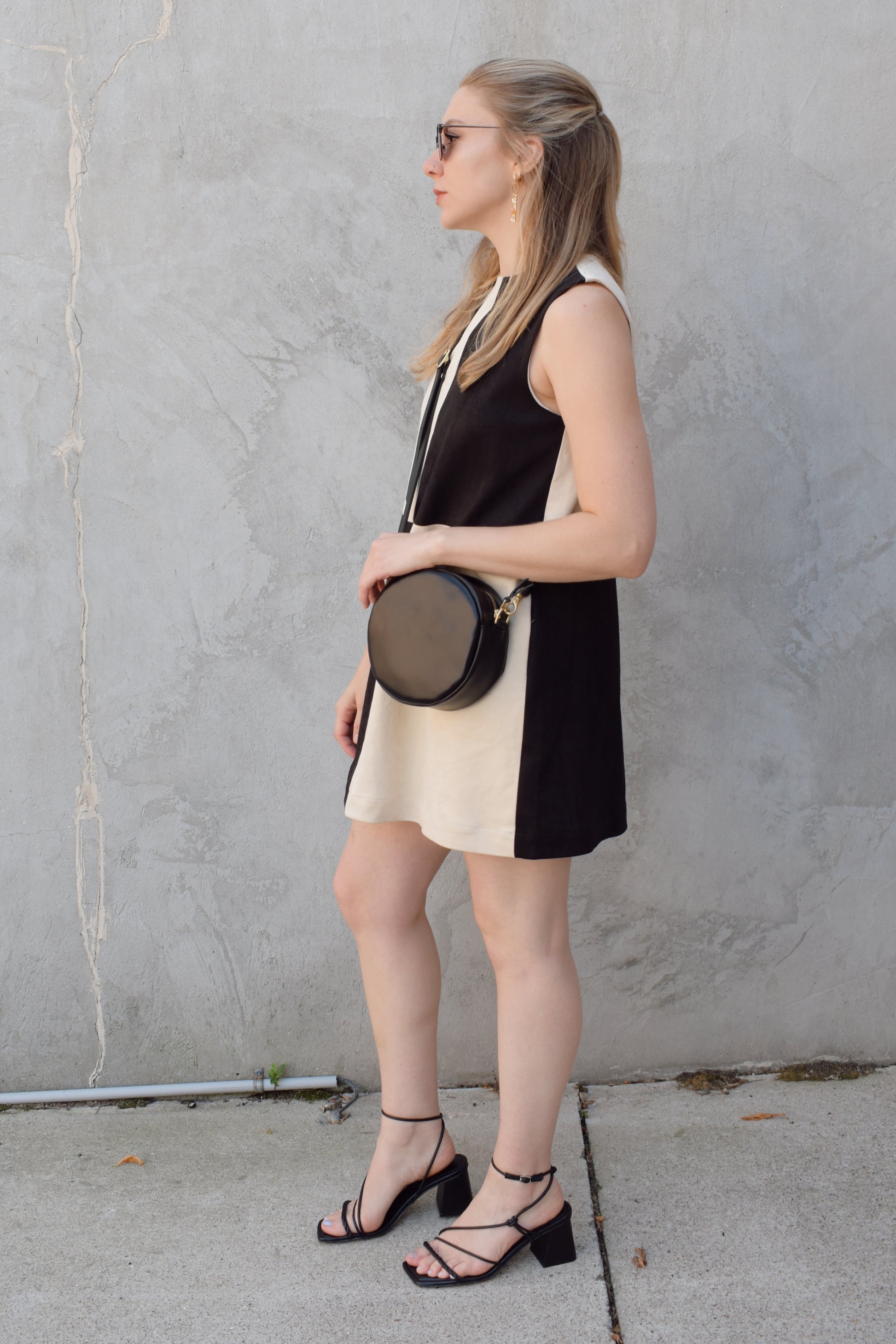 black and ivory color block shift mini dress high neckline sleeveless has pockets