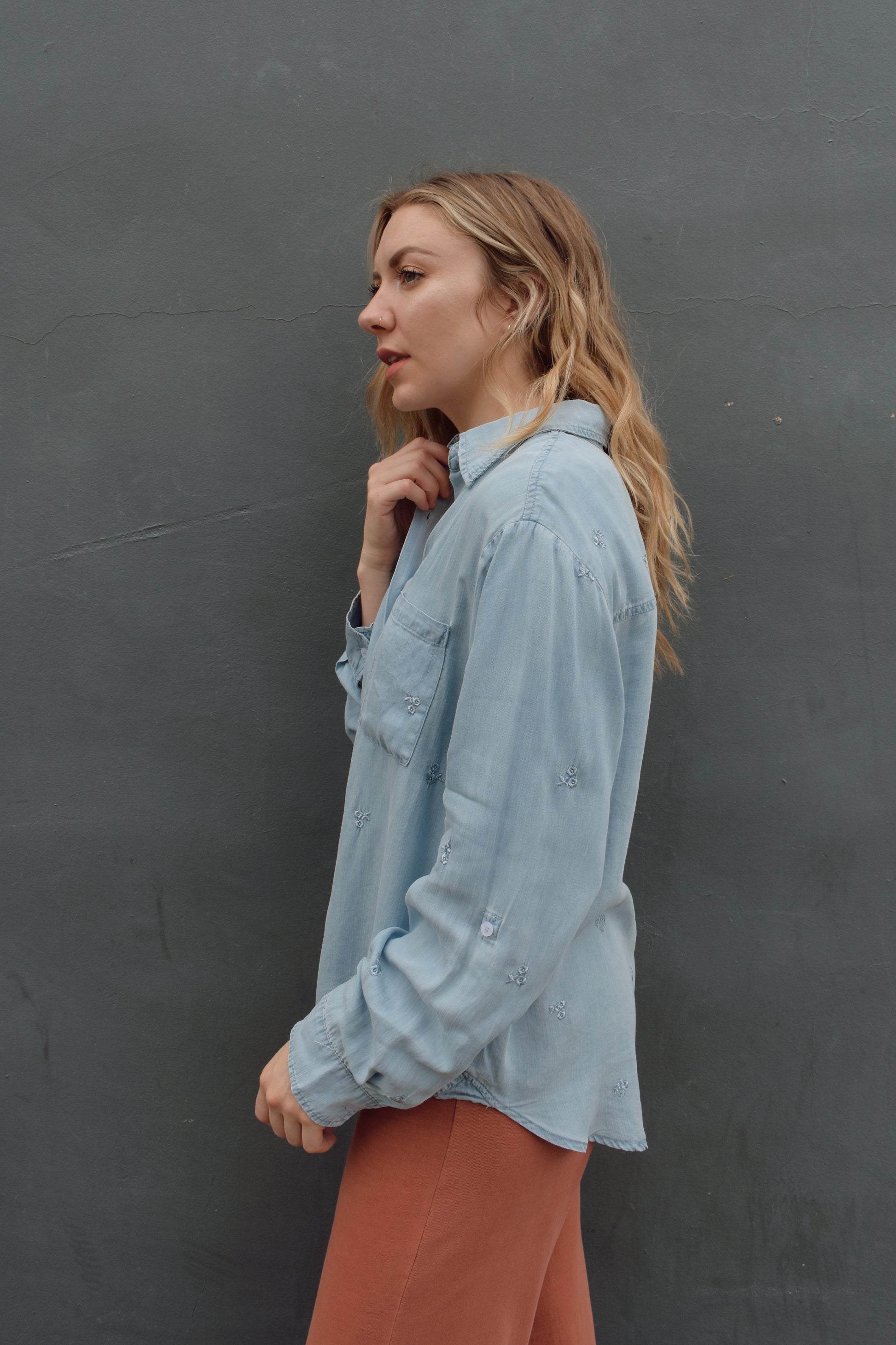 tencel denim chambray button down shirt, oversized relaxed fit, delicate floral embroidery accents same color as button down, one breast patch pocket, sleeves have button for roll up option