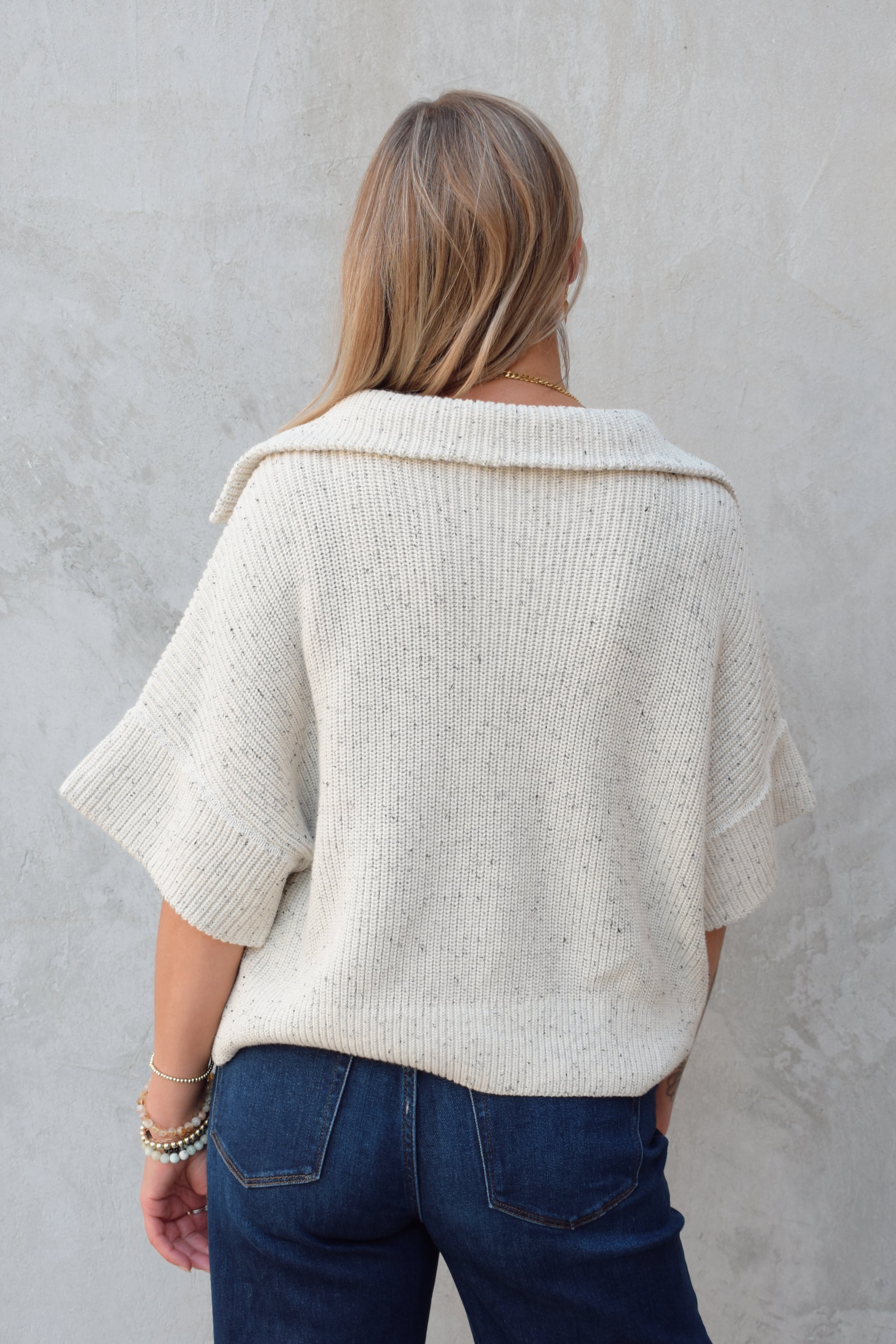 cream half zip short sleeve sweater with oversized collar, relaxed fit, sleeves hit just above elbows