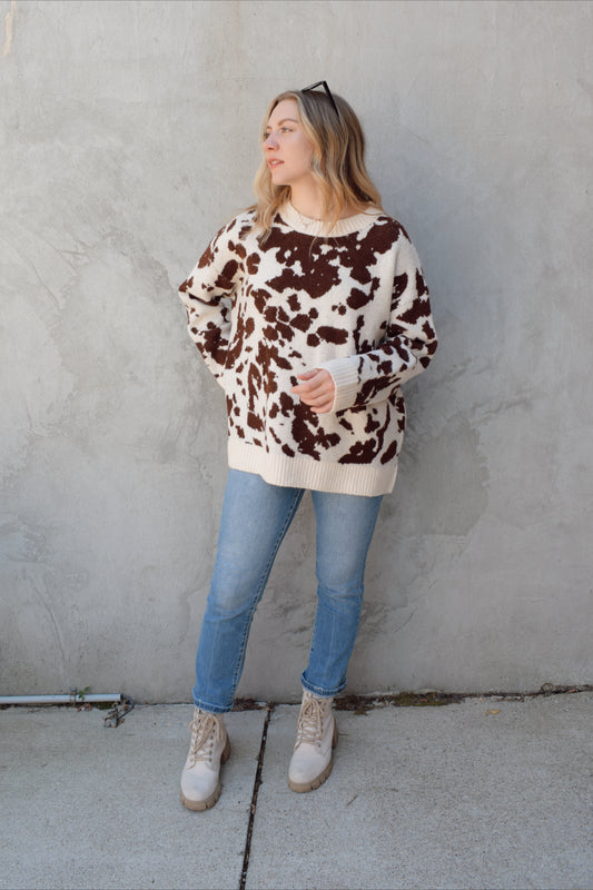 soft oversized cow hide print sweater with crewneck, ribbed neckline hem and cuffs, drop shoulder, very cozy and relaxed not heavy