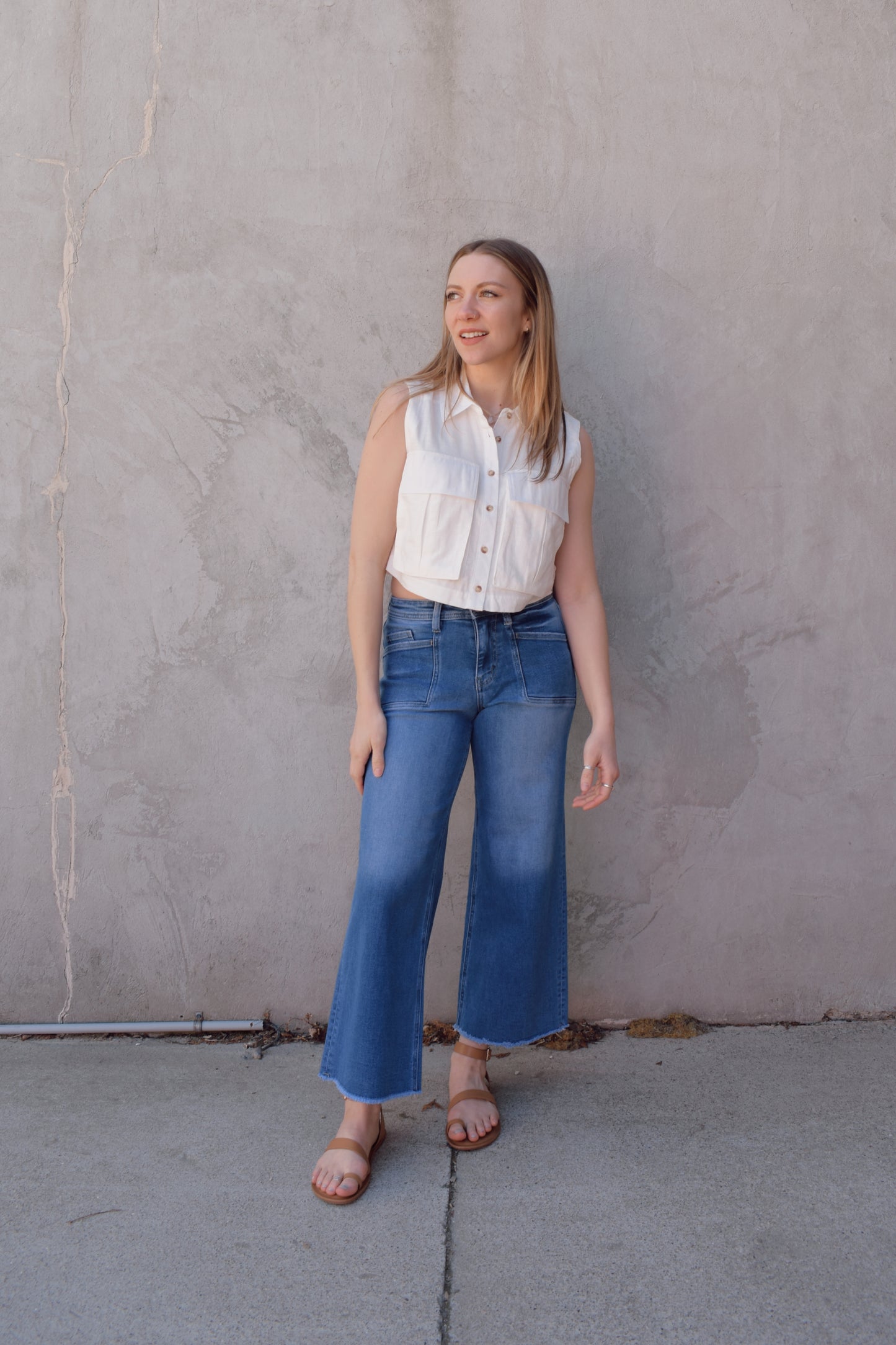 high rise medium wash stretch denim jeans cropped wide leg with retro patch pocket detail no holes has beltloops and back pockets zip and button enclosure