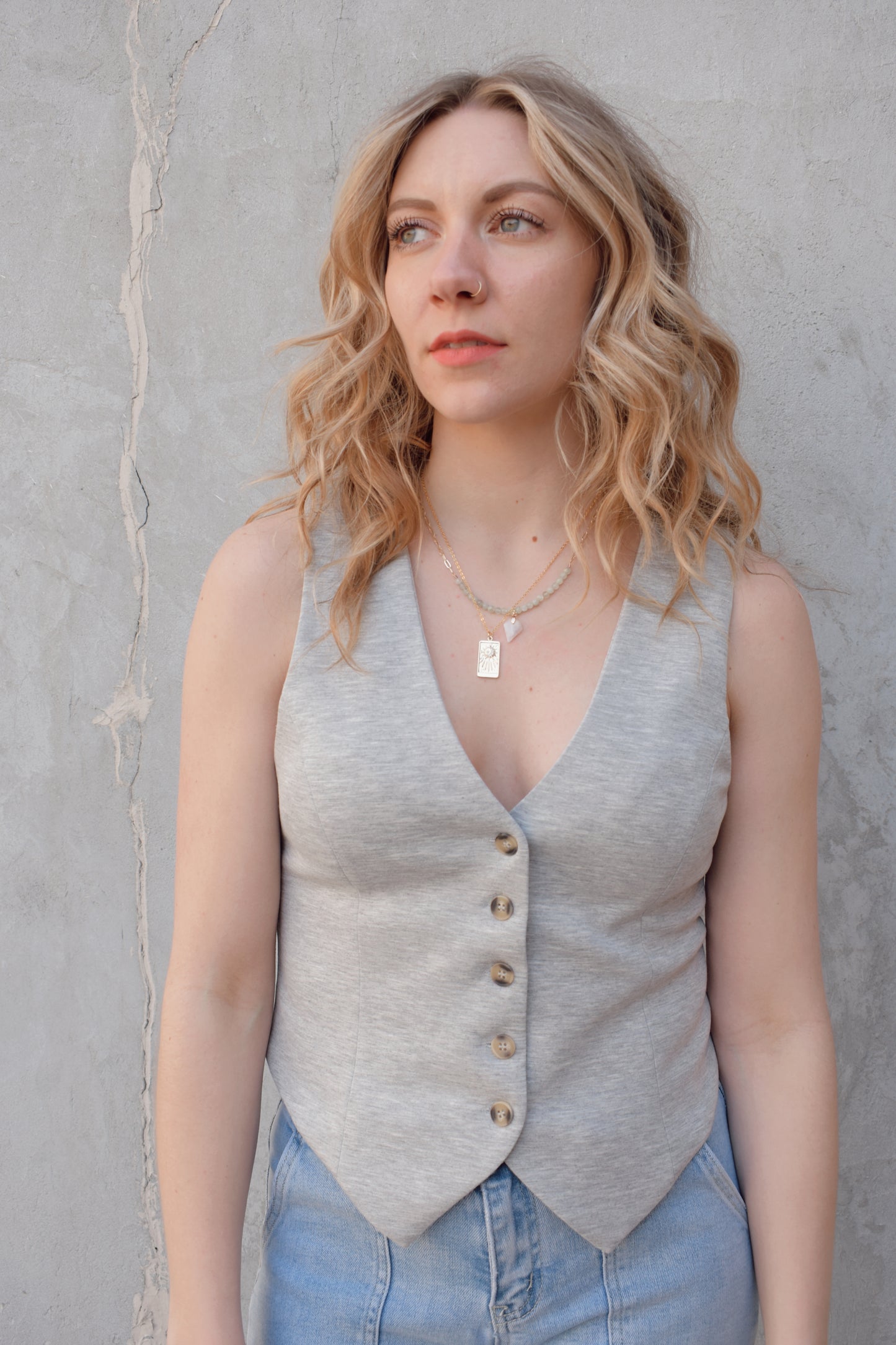 sweatshirt style material fitted button down vest