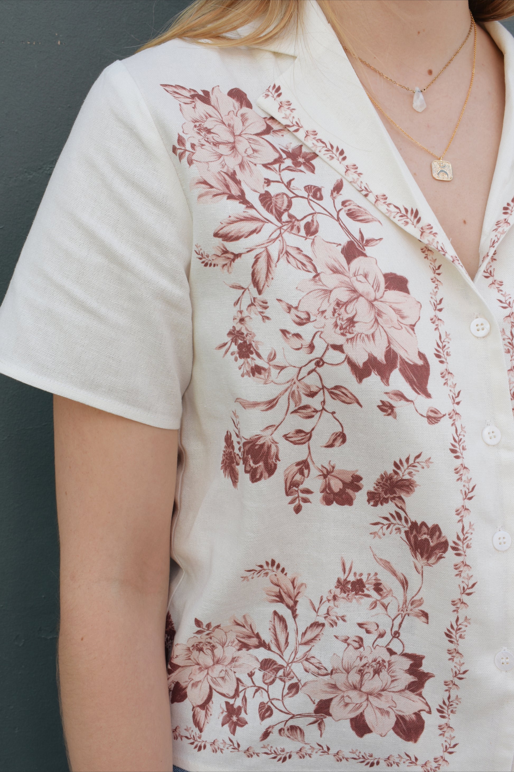 short sleeve off white button down with light maroon printed vintage rose design on front bodice, v neck, relaxed fit
