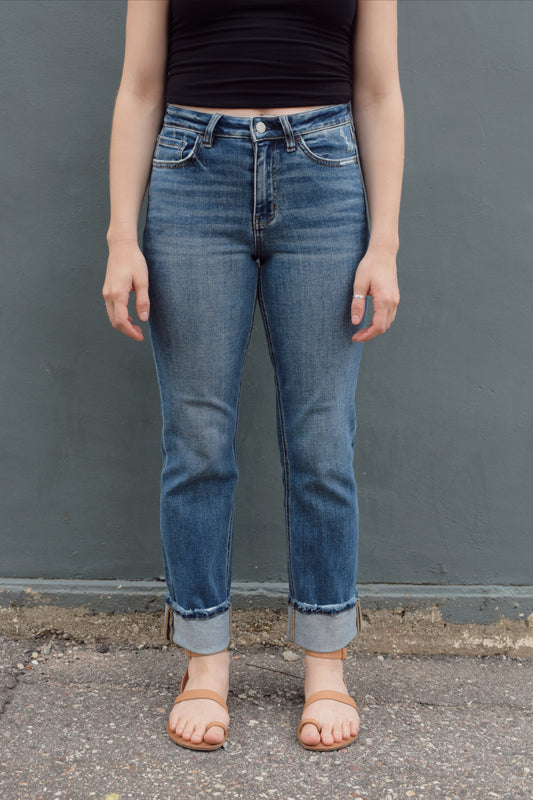 stretch denim straight jeans with cuff that isn't sewn in, zip and button enclosure, no holes, medium wash
