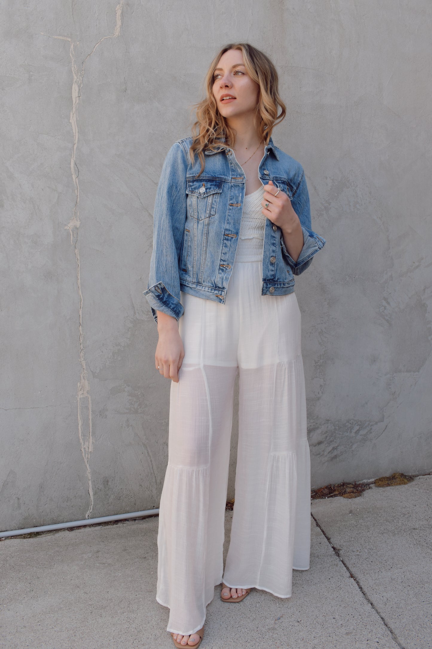 medium wash distressed jean jacket staple for wardrobe relaxed fit full length