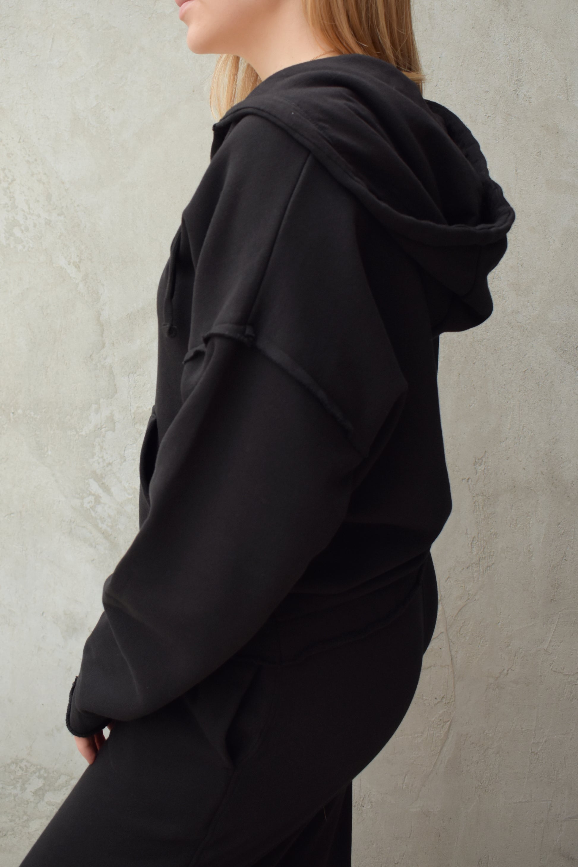 black v neck hoodie - double layered hood with drawstring, drop shoulder, kangaroo pocket, full length relaxed fit, raw edge hems