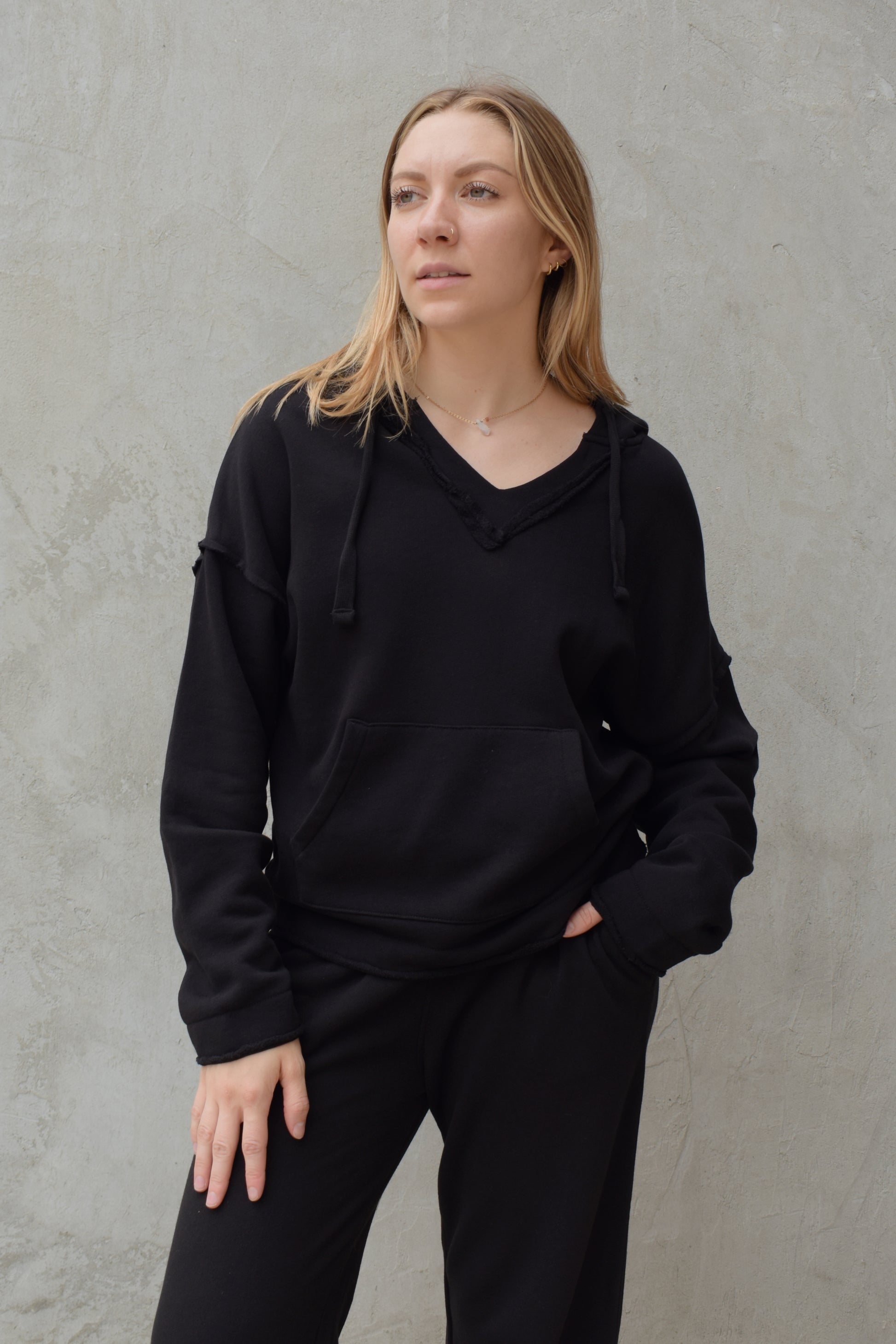 black v neck hoodie - double layered hood with drawstring, drop shoulder, kangaroo pocket, full length relaxed fit, raw edge hems