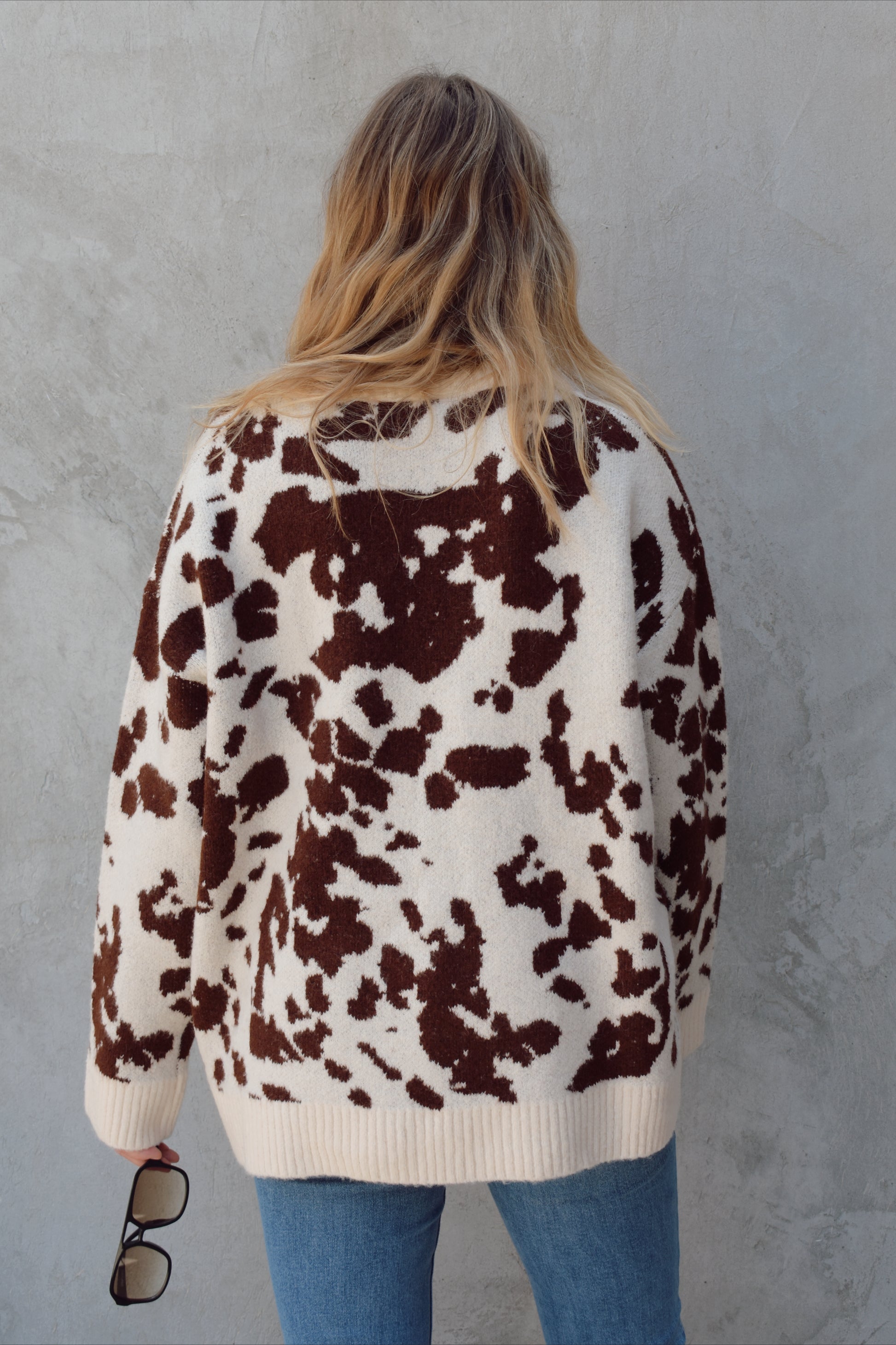 soft oversized cow hide print sweater with crewneck, ribbed neckline hem and cuffs, drop shoulder, very cozy and relaxed not heavy