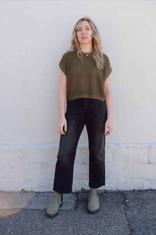 black washed cropped slight barrel jeans stretch denim slanted patch pockets, raw hem, seam detail at knee, high rise, no holes