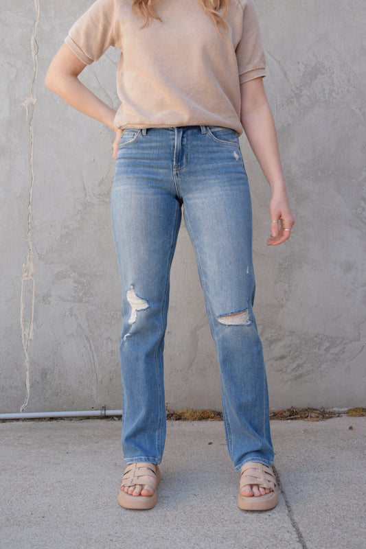 high rise straight jeans medium to light wash with distressing and holes at knees full length high waisted has beltloops stretch denim