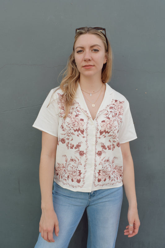 short sleeve off white button down with light maroon printed vintage rose design on front bodice, v neck, relaxed fit