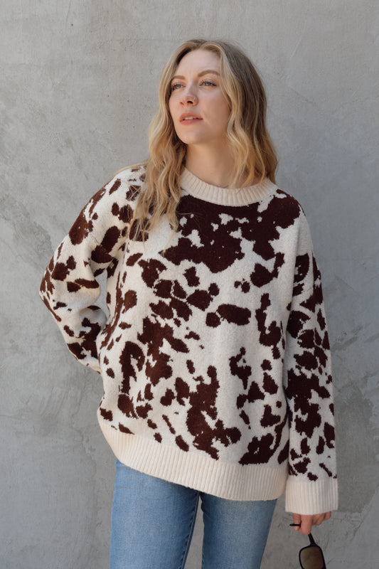 soft oversized cow hide print sweater with crewneck, ribbed neckline hem and cuffs, drop shoulder, very cozy and relaxed not heavy