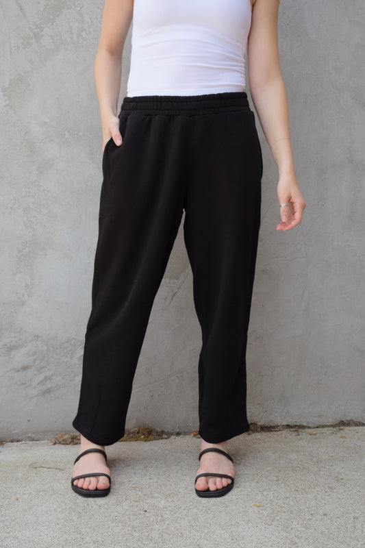 lounge sweat pant with elastic waistband and drawstring on the inside. Has pockets and a straight relaxed fit hits right at ankles. athleisure
