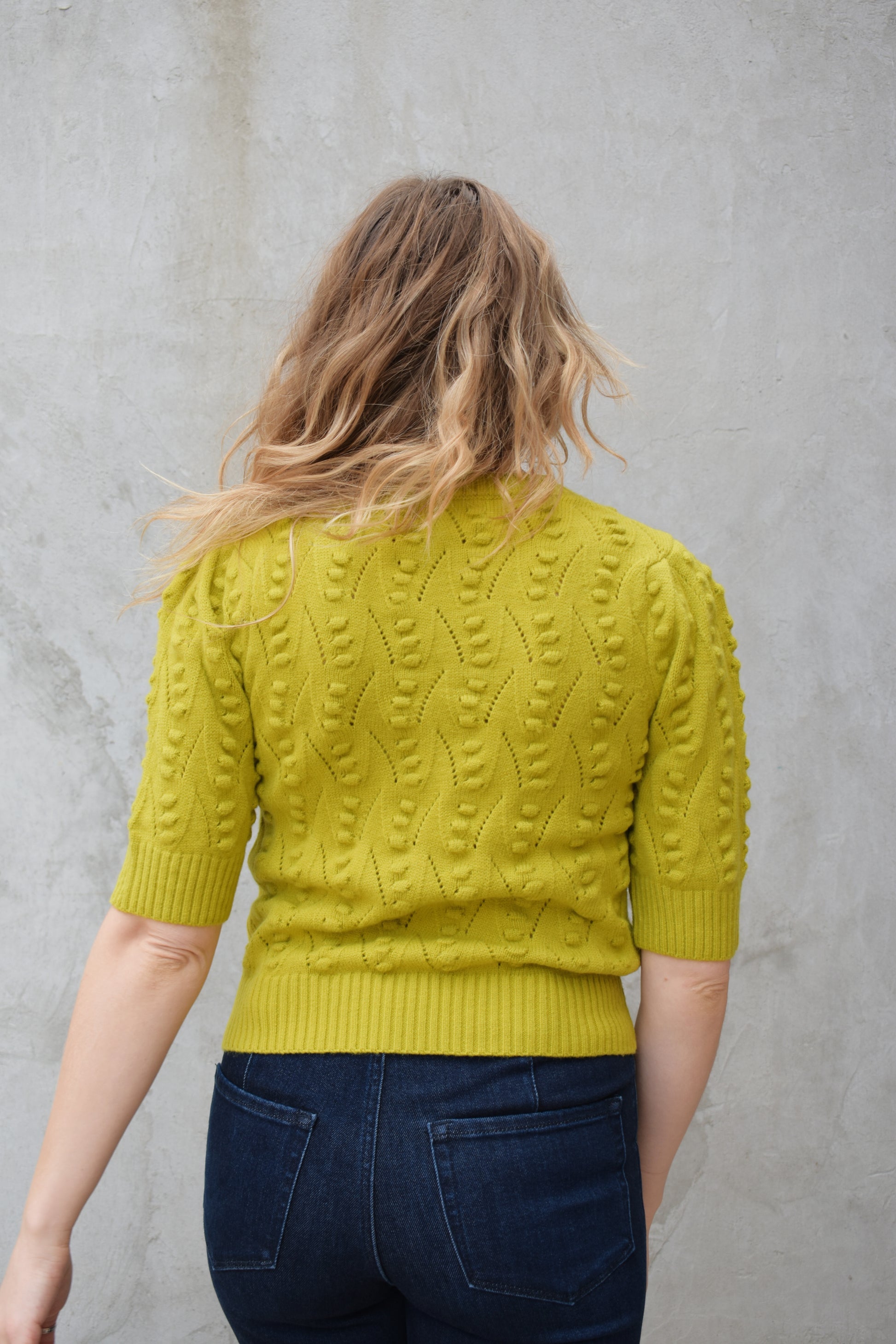 short sleeve crew neck sweater with  popcorn knit pointelle design and ribbed texture on cuffs hem and neckline chartreuse color straight fit
