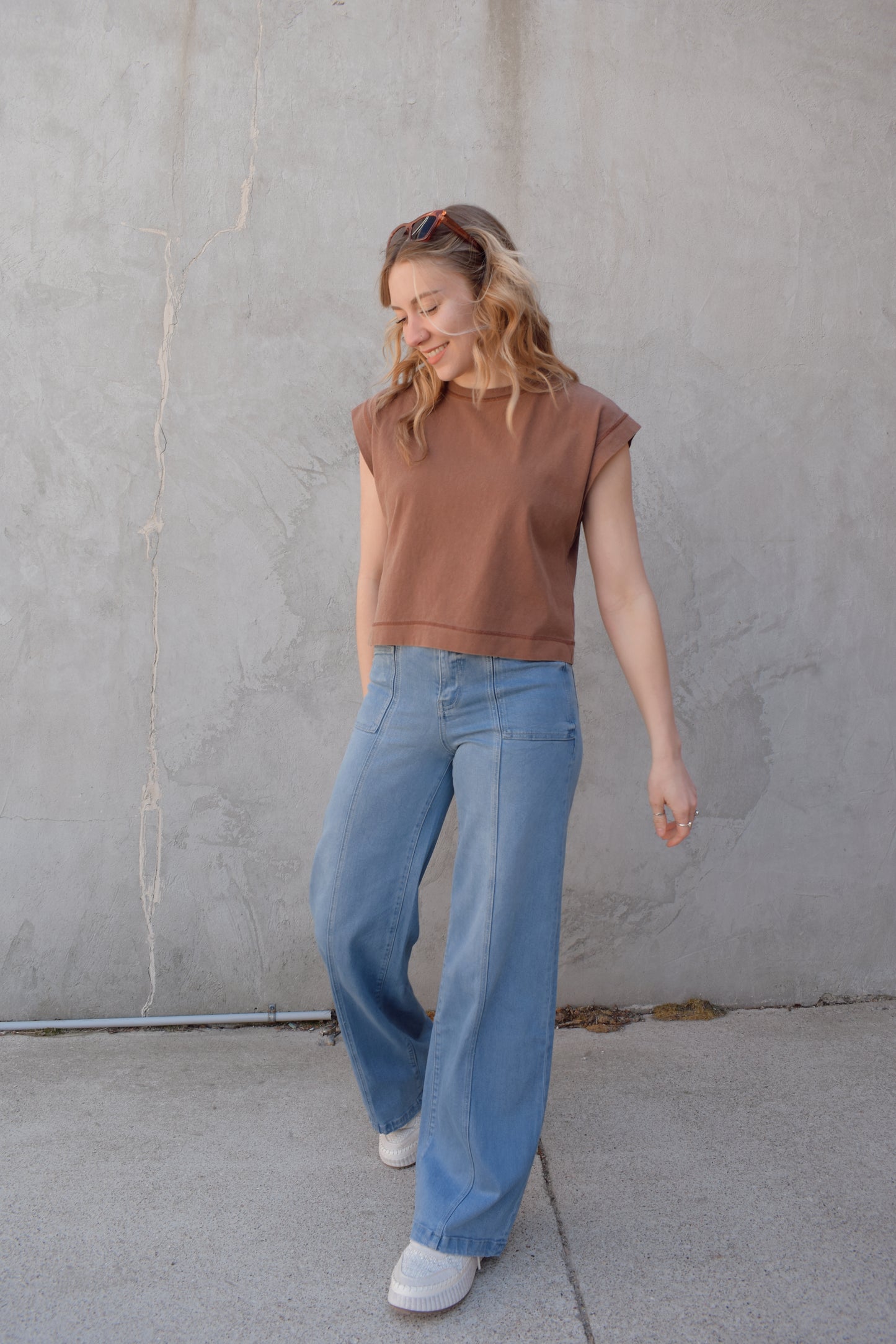 high waisted wide leg full length stretch denim retro jeans with front patch pockets front seam detail light wash no distressing or holes has beltloops zip and button enclosure has back pockets