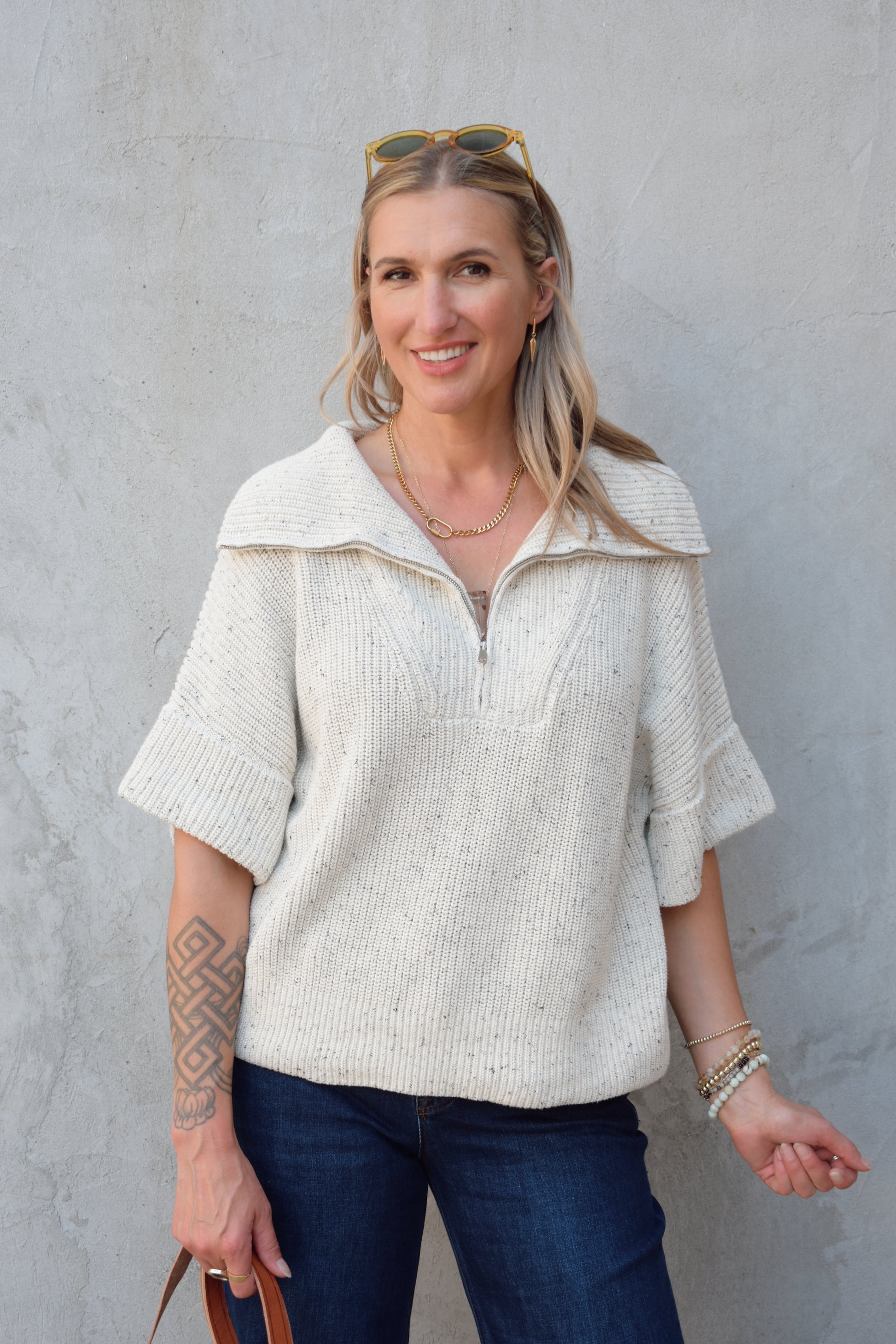 cream half zip short sleeve sweater with oversized collar, relaxed fit, sleeves hit just above elbows