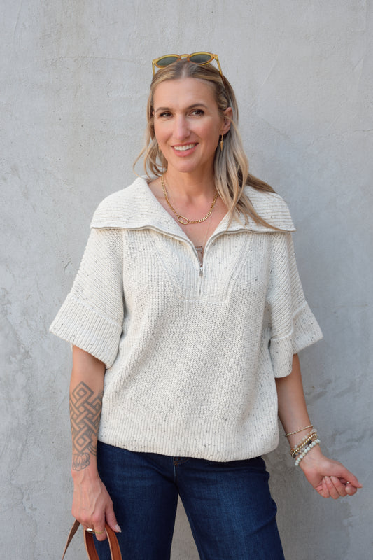 cream half zip short sleeve sweater with oversized collar, relaxed fit, sleeves hit just above elbows